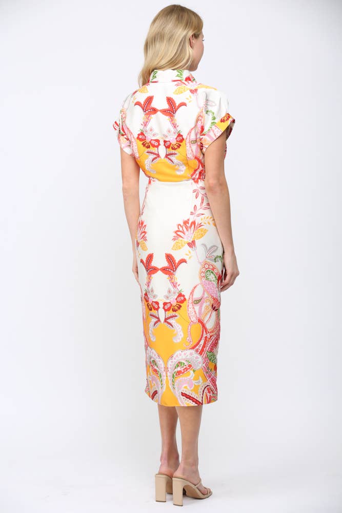 Rear view of woman wearing BOTANIC SCARF PRINT SELF TIE WAIST BUTTON DOWN DRESS with colorful floral patterns and short sleeves