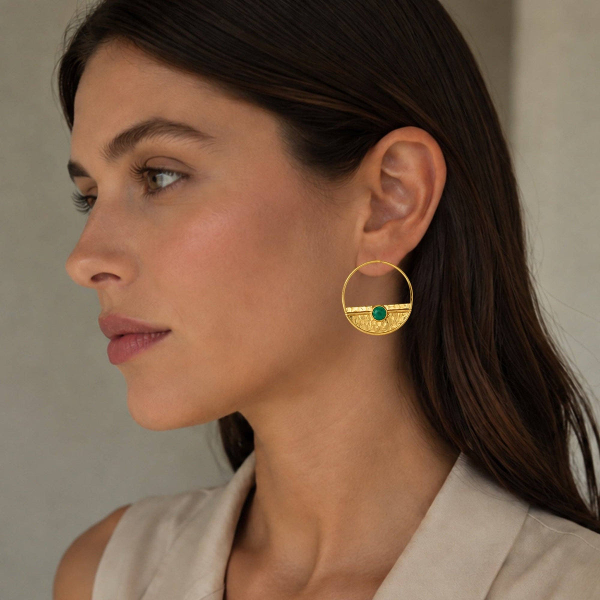 Yarim Ay Green Jade Stud Earrings worn by a model with a gold circular design and green jade detail