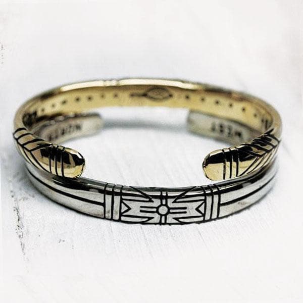 Medicine Wheel Cuff || Men featuring intricate engraved design on a polished brass and silver-tone metal band.