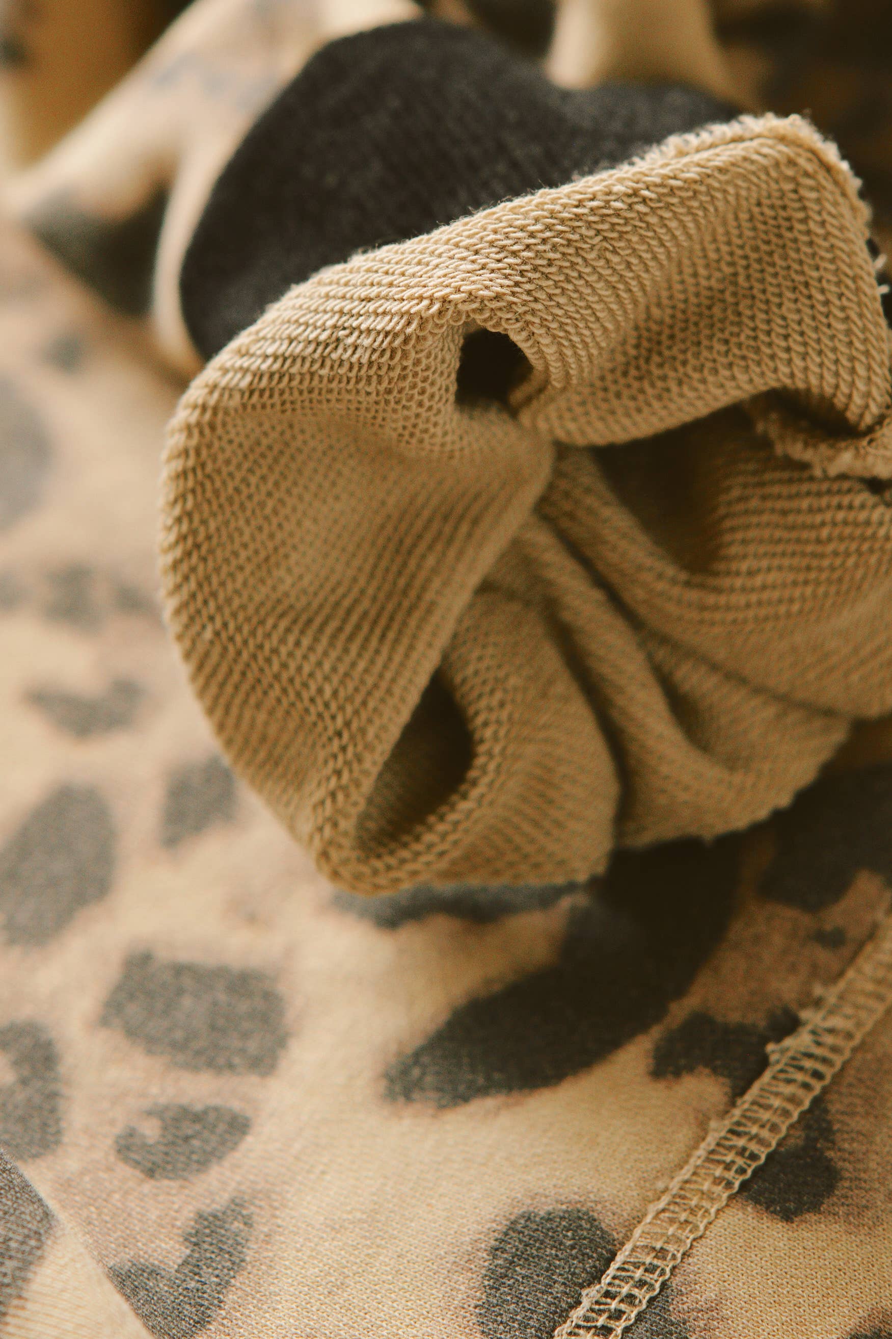 Close-up of soft fabric details and stitching on SORRY MOM HOODIE - PRESALE showcasing texture and quality craftsmanship