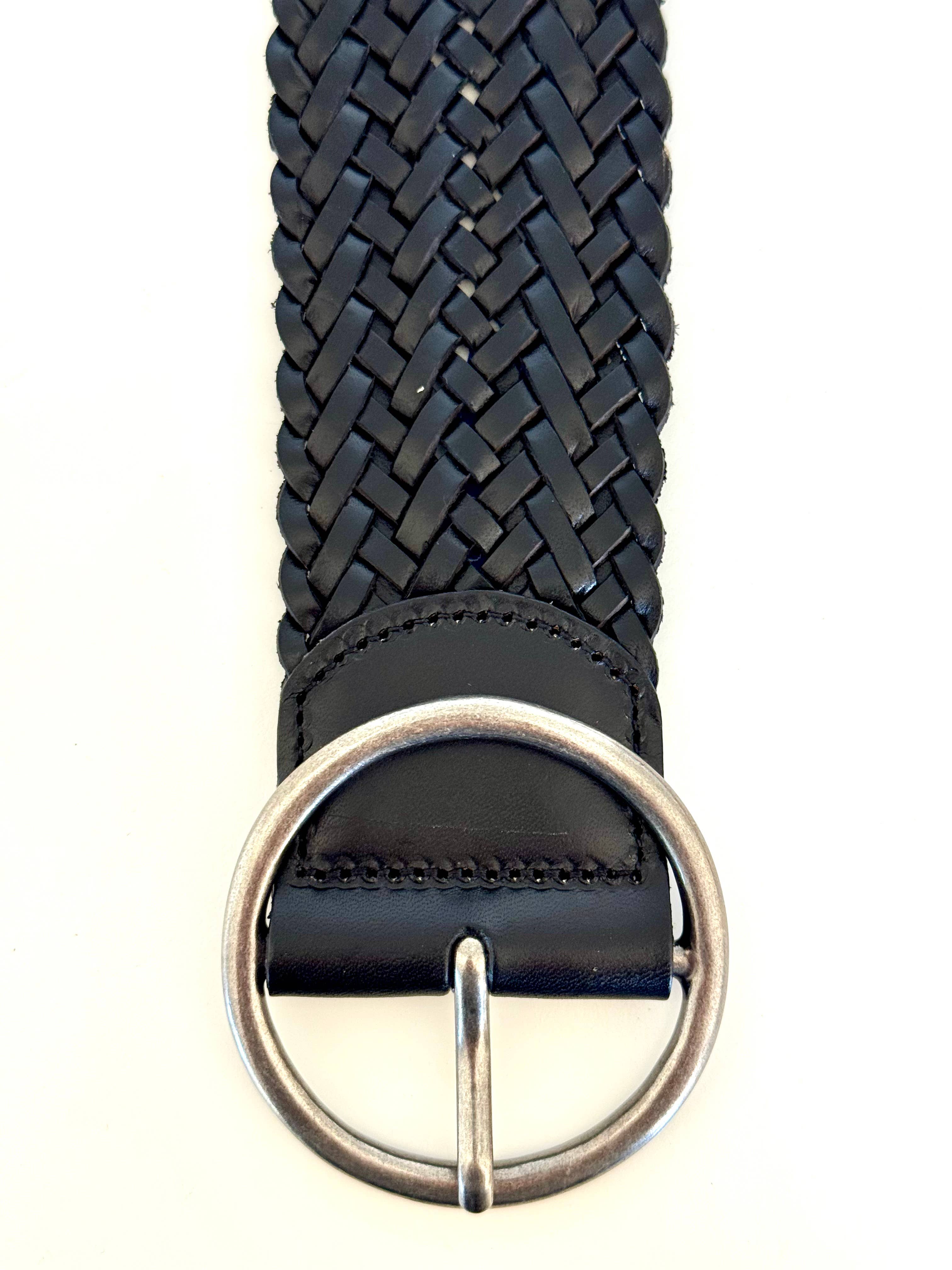A close-up of the Ginger Blue Classic Wide Braided Leather Belt in Black, featuring a round vintage silver buckle, displayed against a white background.