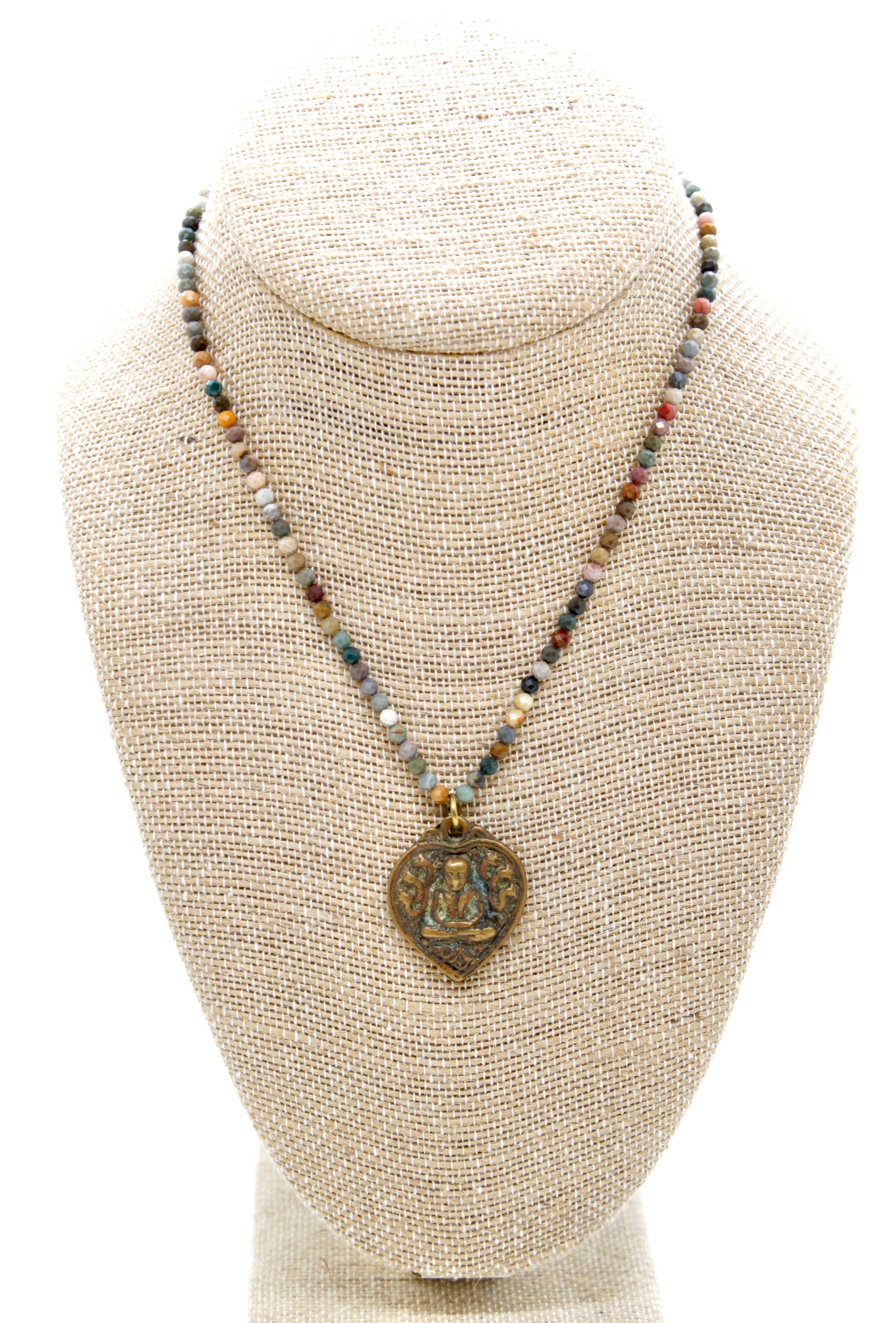 Buddha Necklace 121 - Faceted Alashan Agate Stone Necklace featuring colorful beads and a bronze Buddha pendant displayed on a bust