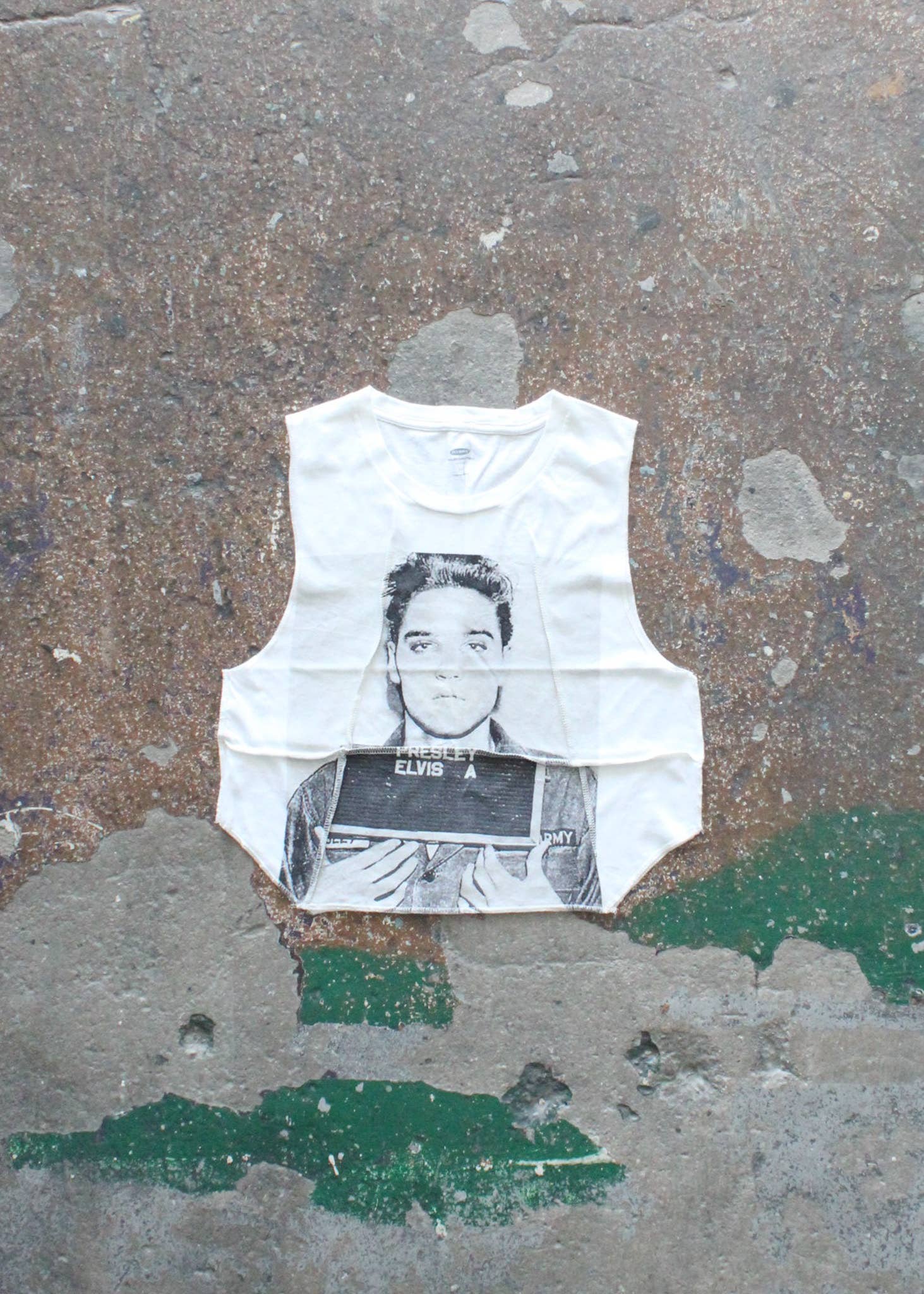 Overlock Cropped Music Muscle Tee featuring a black and white graphic of a musician on a concrete background