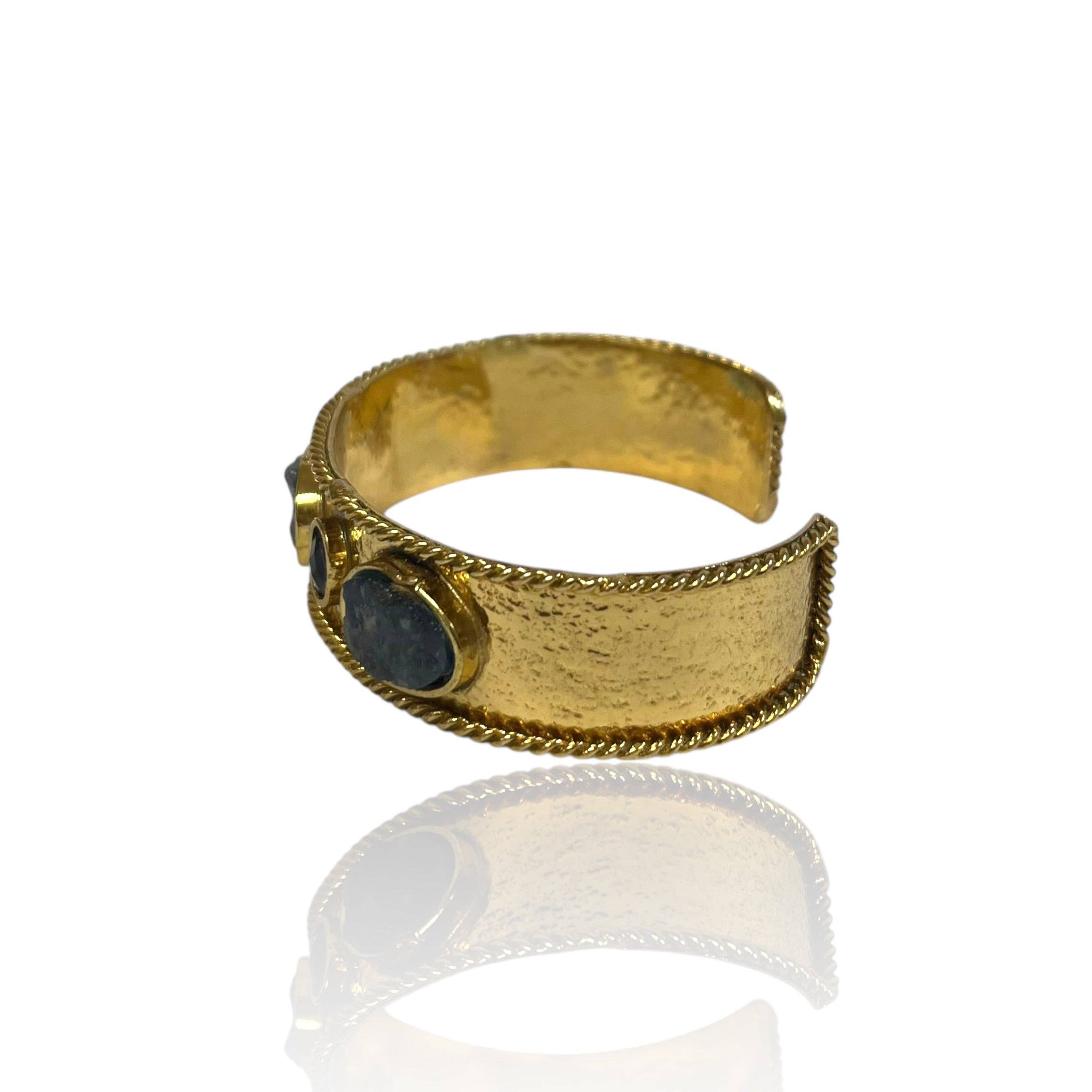 Smoky Quartz Gem Cuff featuring a textured gold band accented with two smoky quartz stones in a bold design