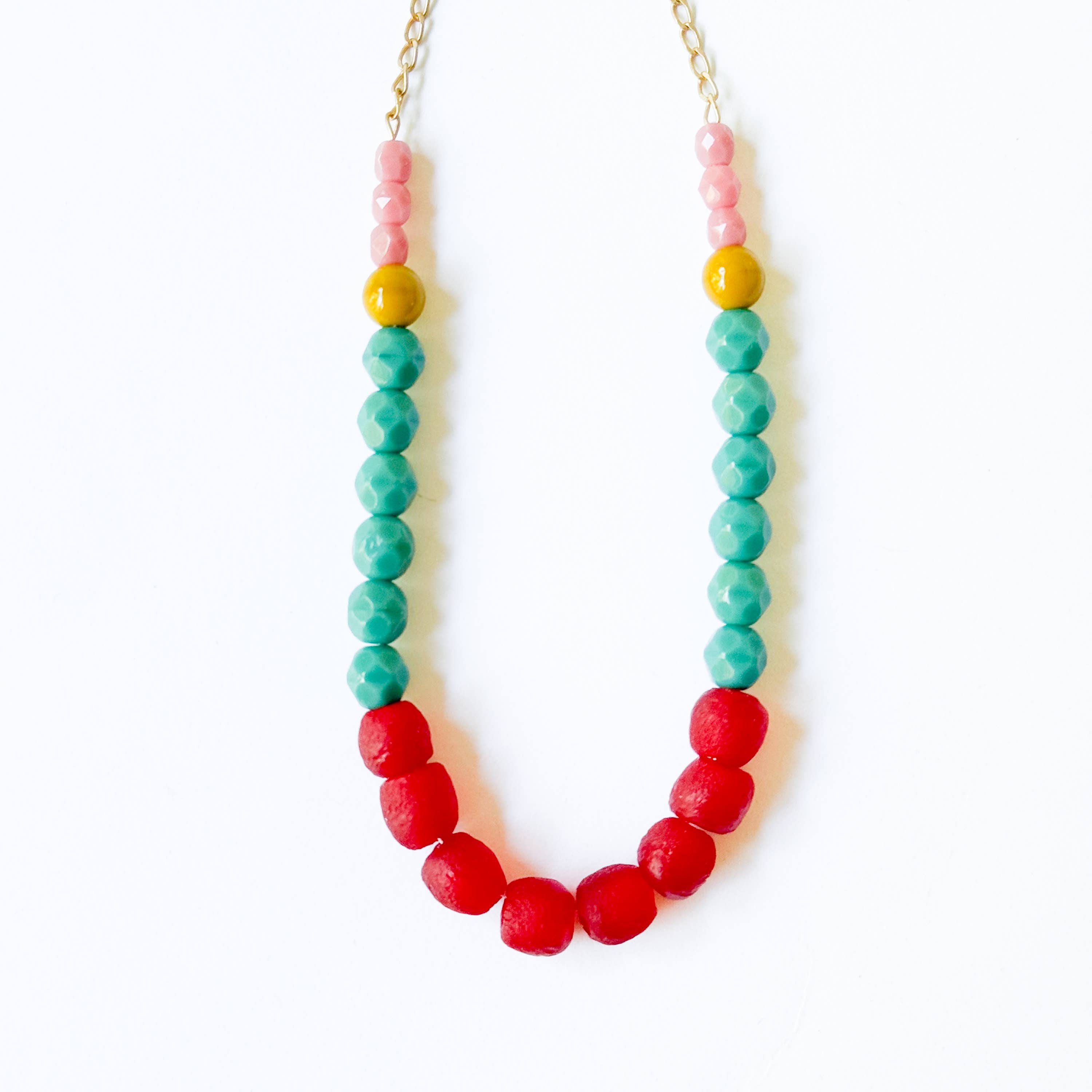 Multicolor Recycled African Glass And Mixed Bead Necklace with vibrant red, turquoise, yellow, and pink beads on a gold chain