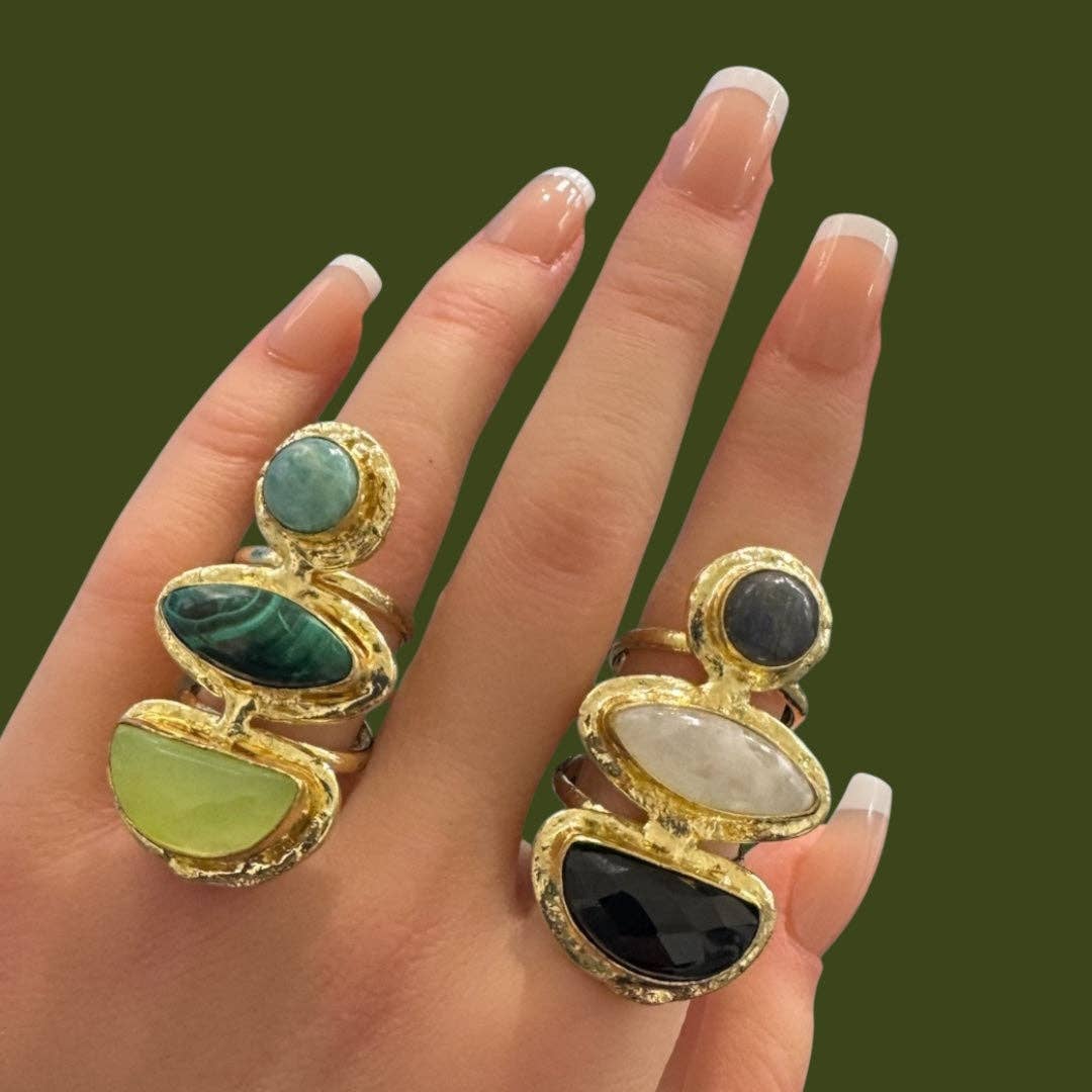 Elegant Cocktail Rings featuring bold stacked stones set in textured gold bands on a hand with French manicure
