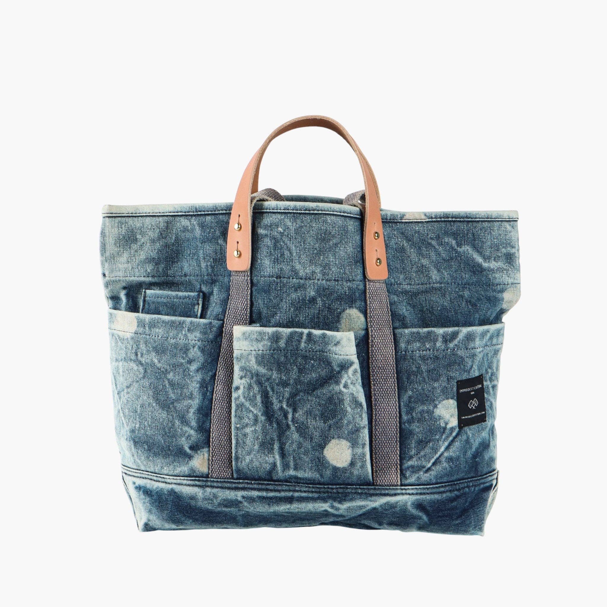 Construction Tote | Denim Moon with durable denim fabric, multiple exterior pockets, and leather handles for easy carrying