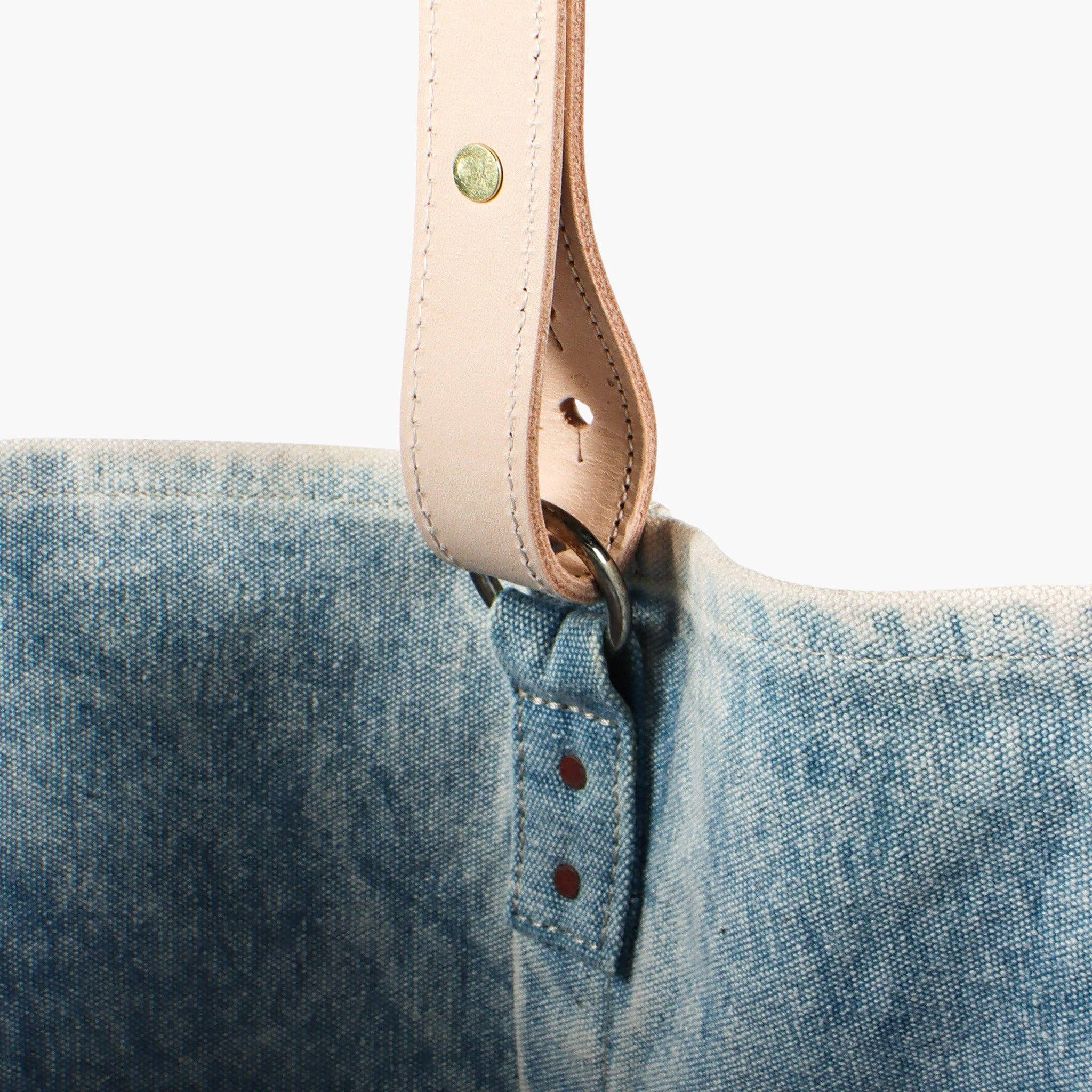 Close-up of the acid wash fabric and leather strap detail on the Electrician Tote | Acid Wash bag