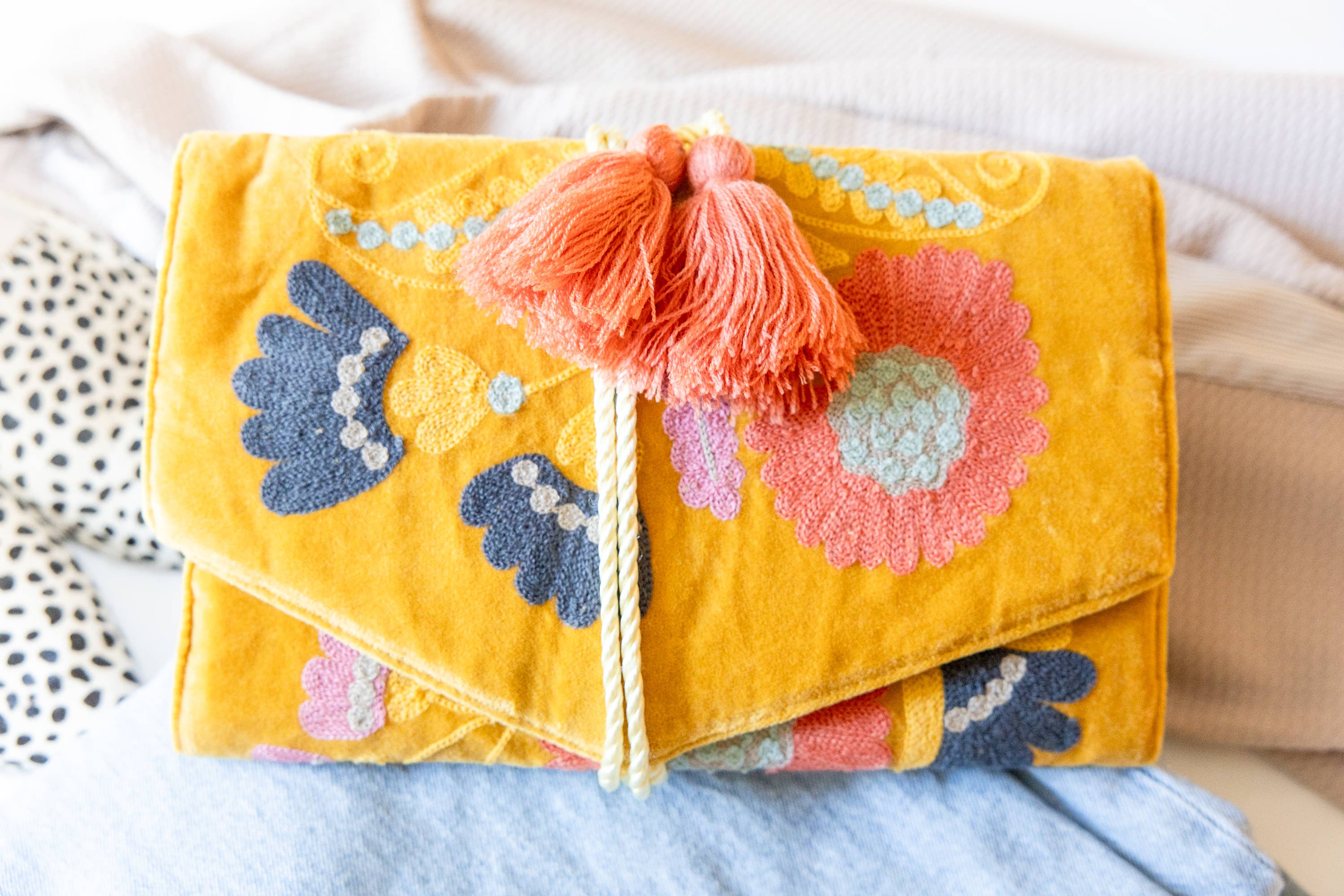 Embroidered Velvet Jewelry Organizer-Mustard with floral embroidery and coral tassels showcasing vibrant artisan design.