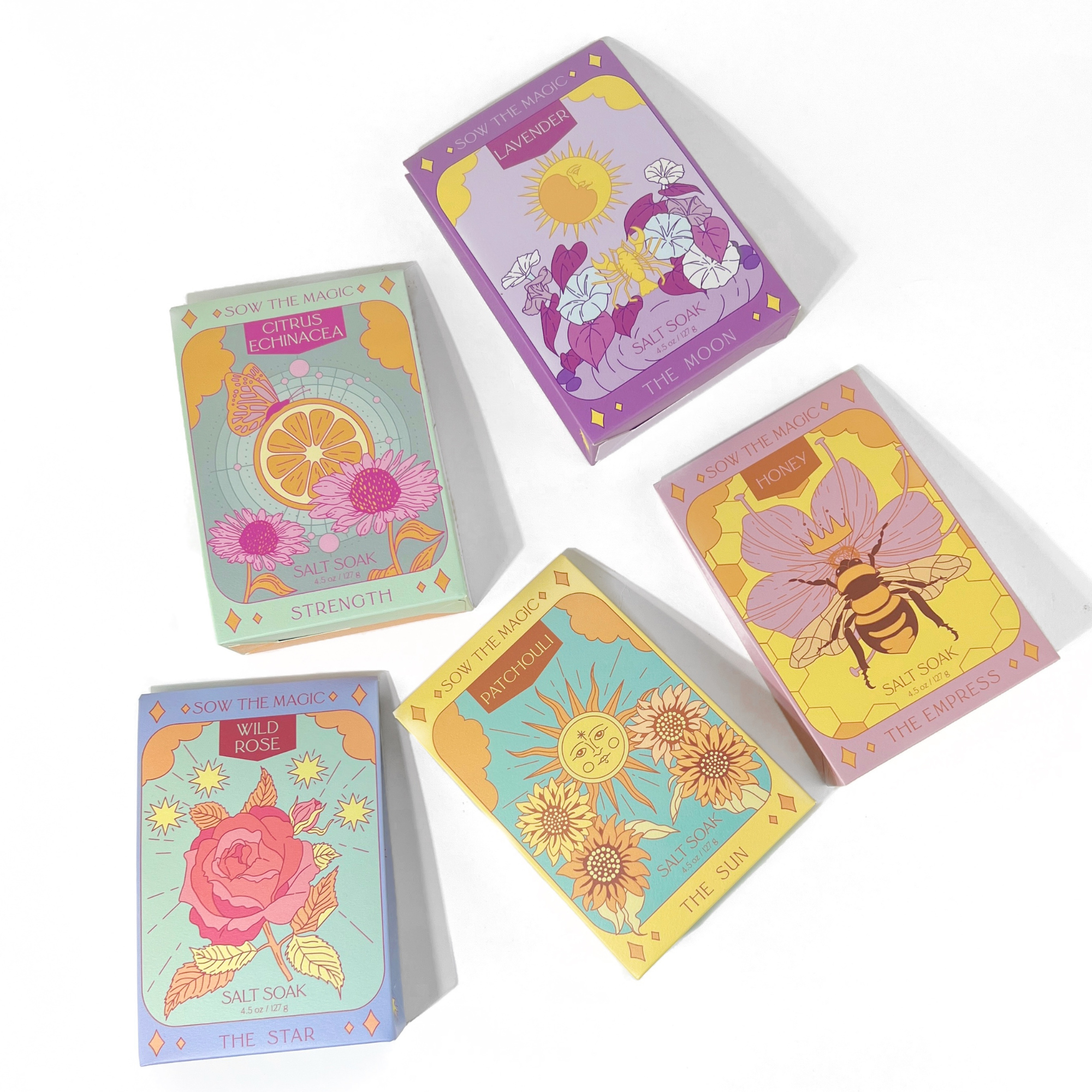 Strength Salt Soak in Citrus Echinacea box among other colorful illustrated salt soak packaging on white background