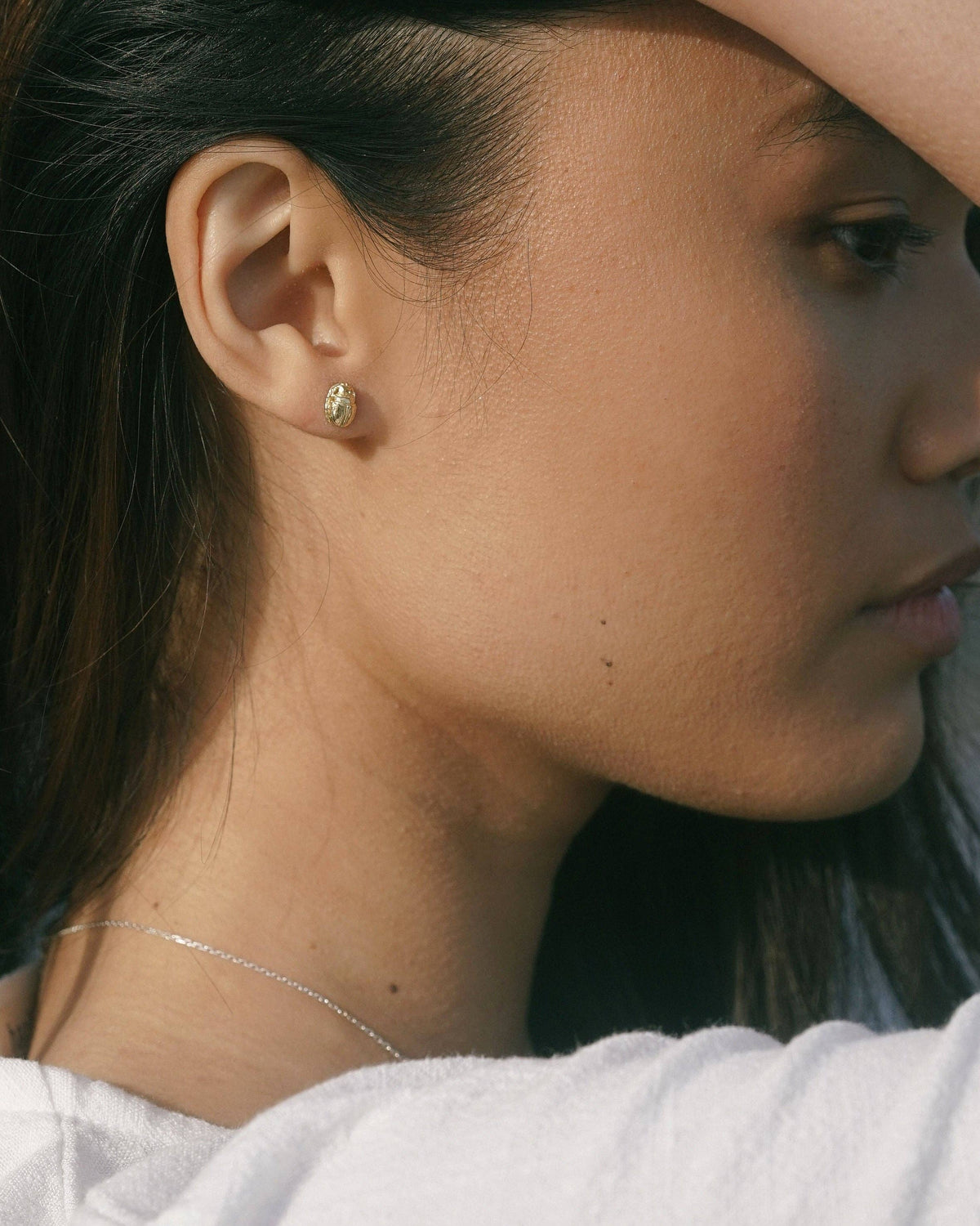 Scarab Stud gold scarab earring worn on the ear