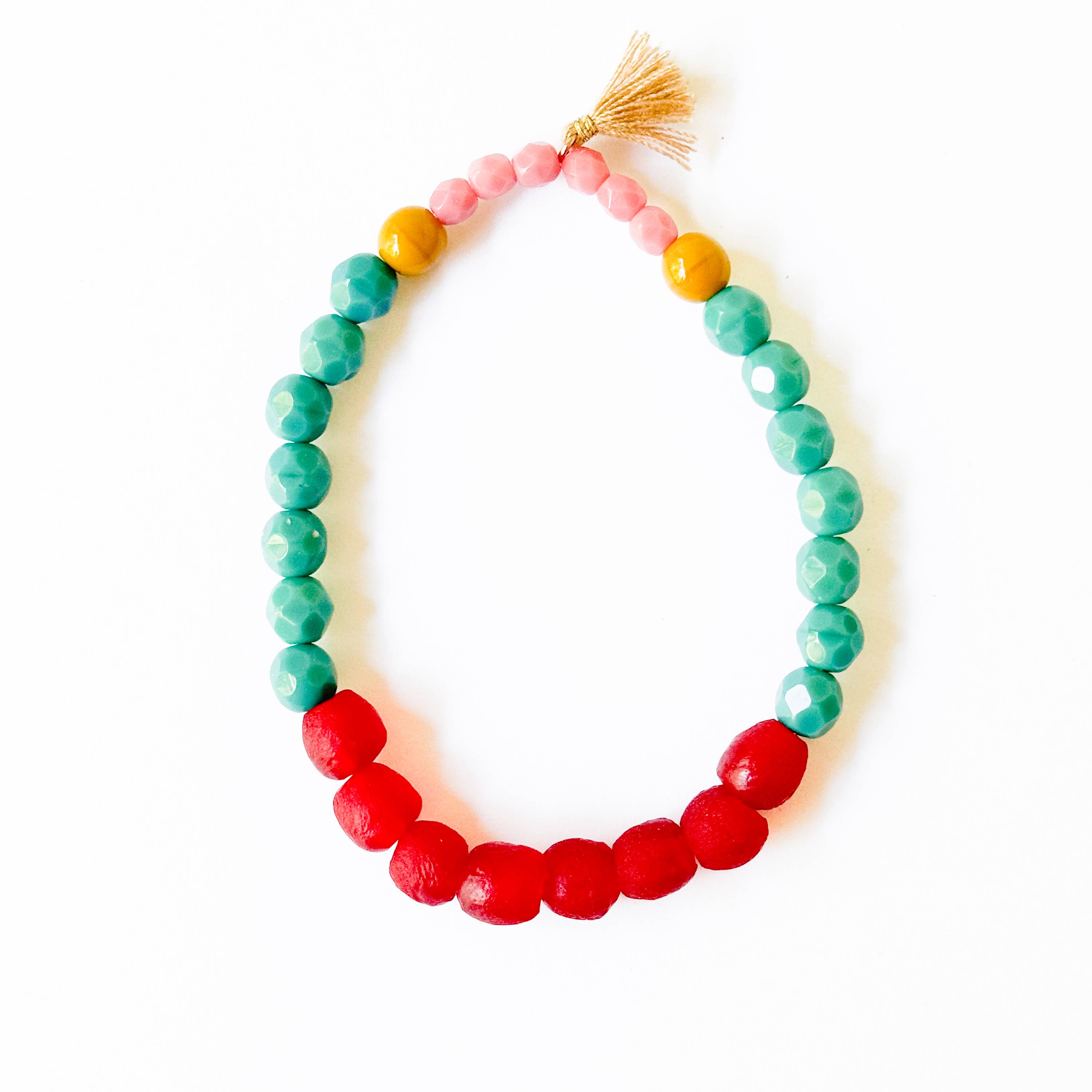 Multicolor Recycled African Glass And Mixed Bead Bracelet with red, turquoise, pink, and yellow beads and a small tassel detail