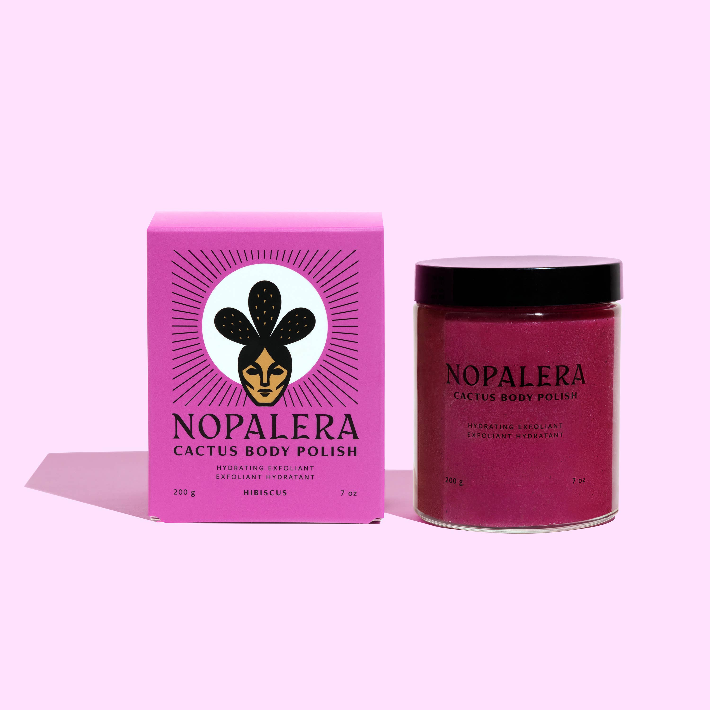 Hibiscus Cactus Body Polish in a vibrant pink jar and matching box with bold artistic design on a light background