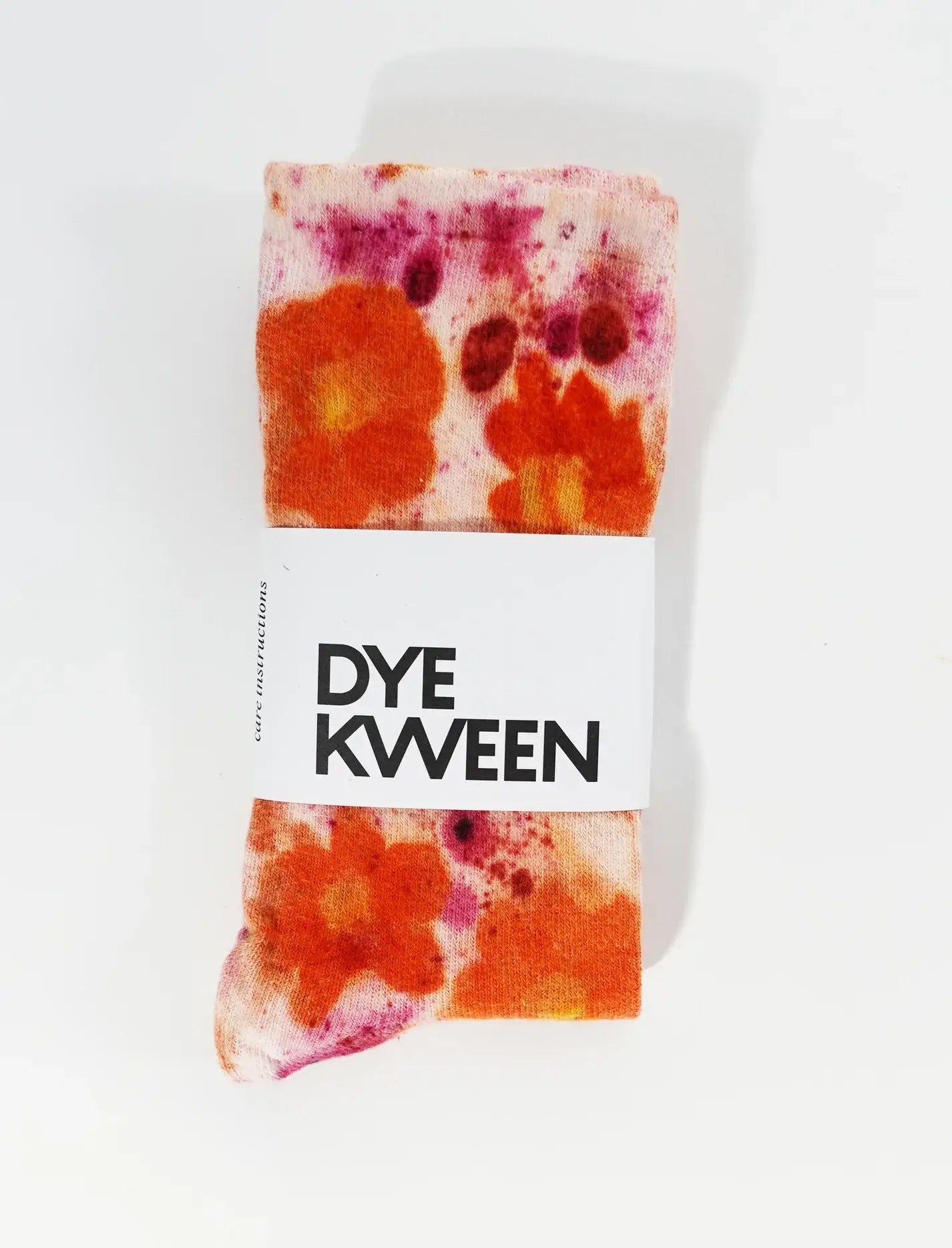Flower Power Cotton Crew Sock with vibrant orange and pink floral dye pattern, soft cotton fabric, stylish and cozy design.