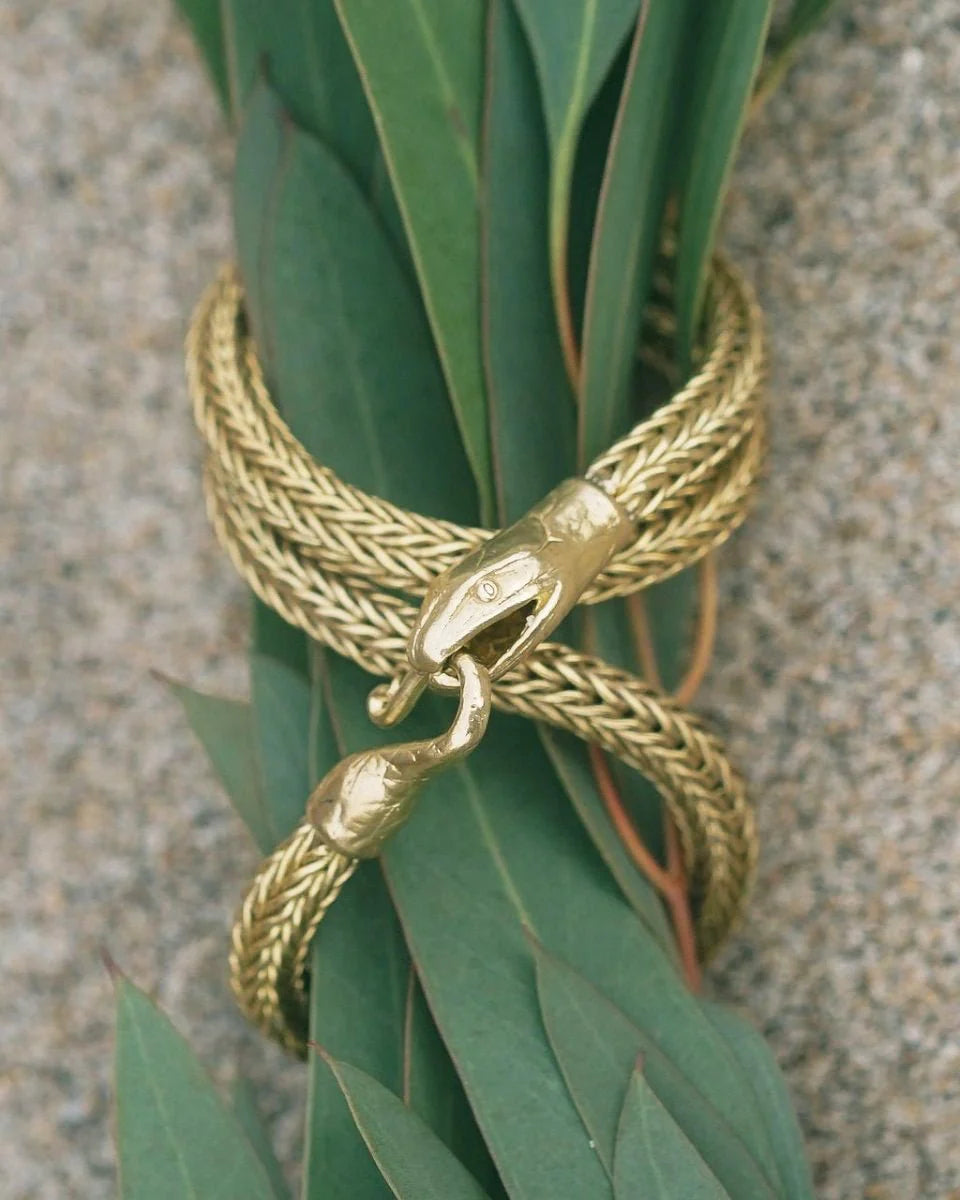Serpent Choker Necklace in gold-tone with detailed snake heads wrapped around green leaves for a bold statement piece