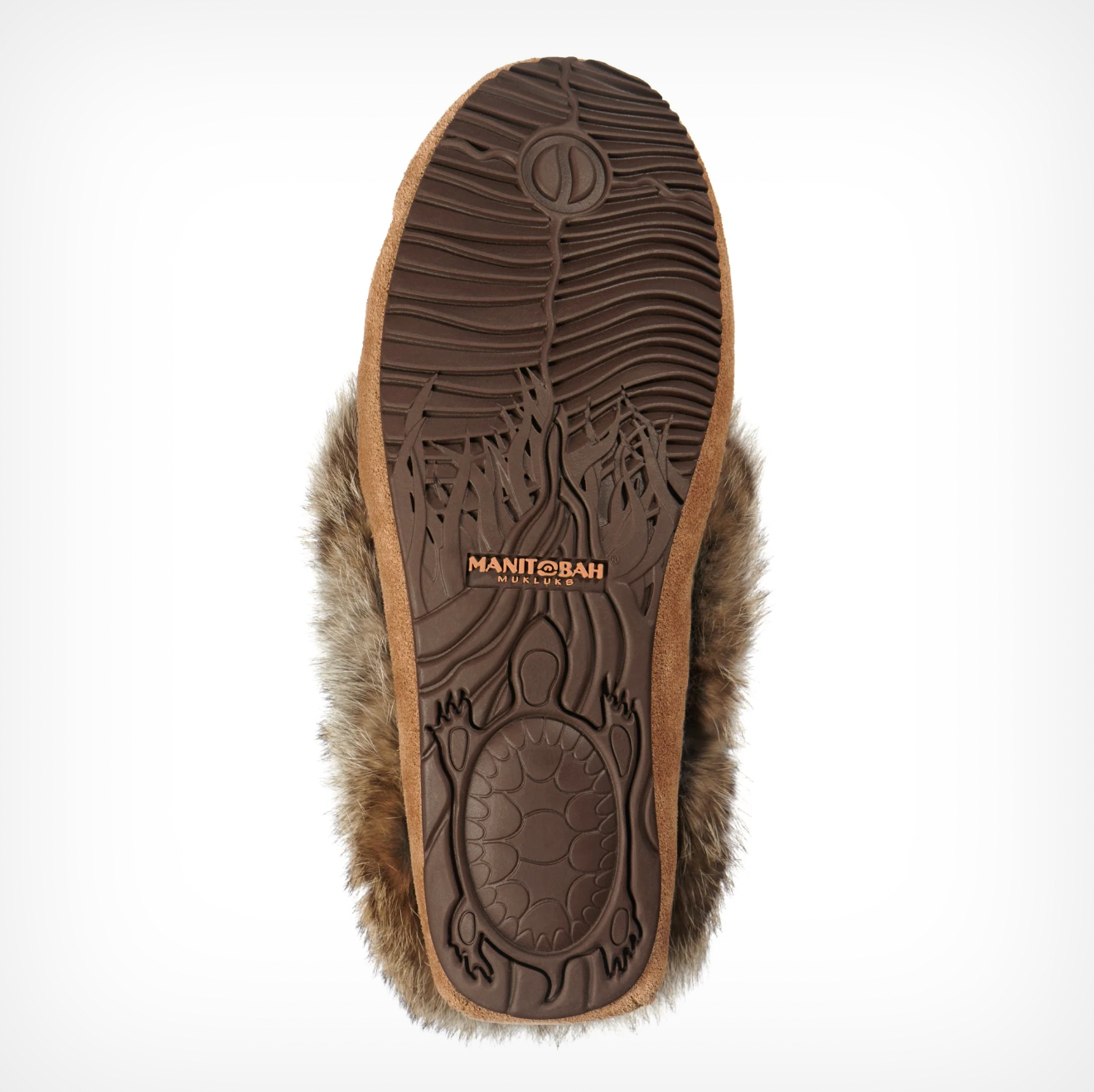 The Street Moc In Oak by Caravan features a textured sole with a turtle design and "CARAVAN" in orange. The edge is trimmed with brown fur, adding warmth and style to this fur-lined moccasin.