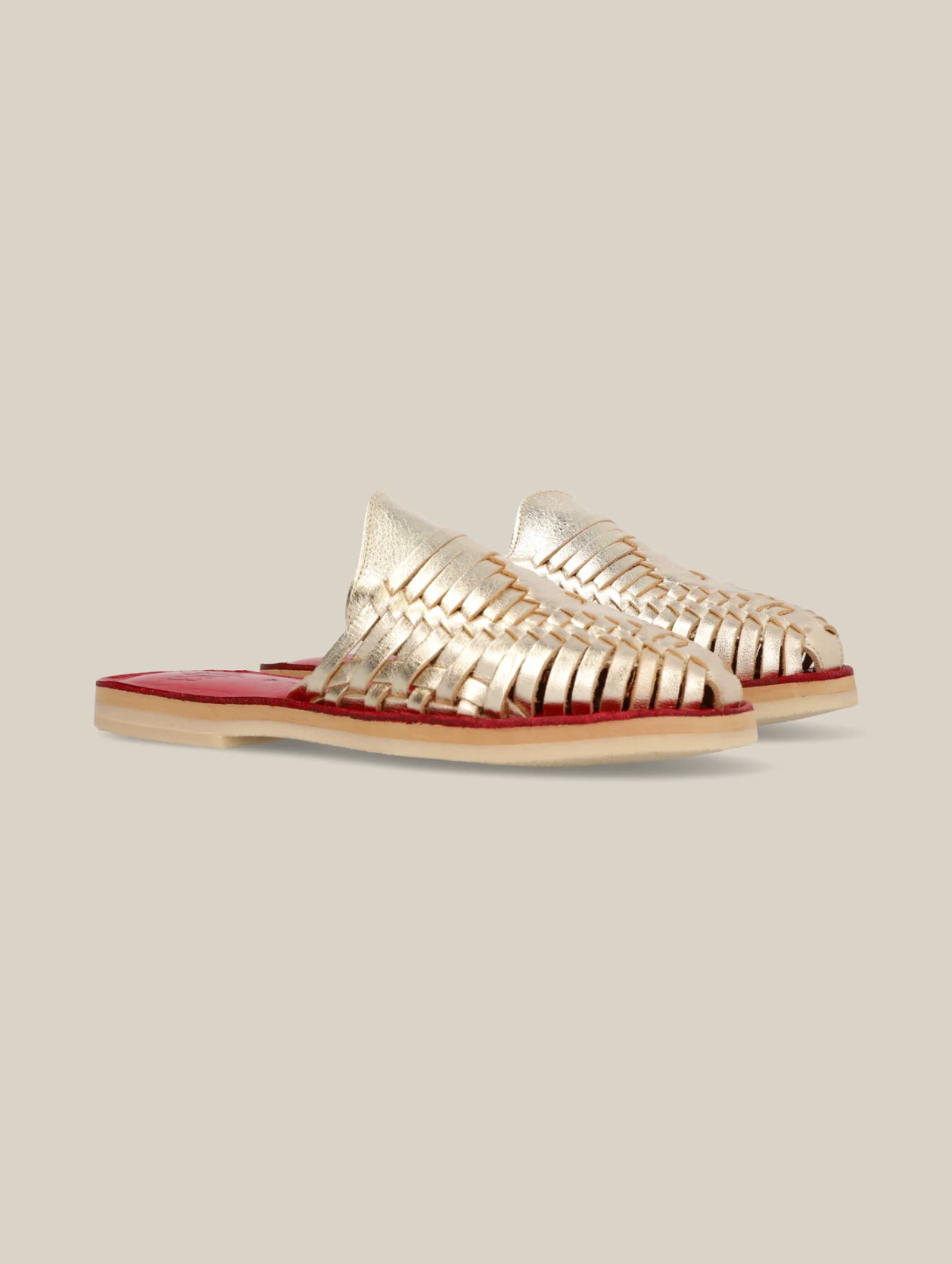 Gold Slip On Huarache Sandal with woven metallic upper and red cushioned sole, stylish and comfortable design