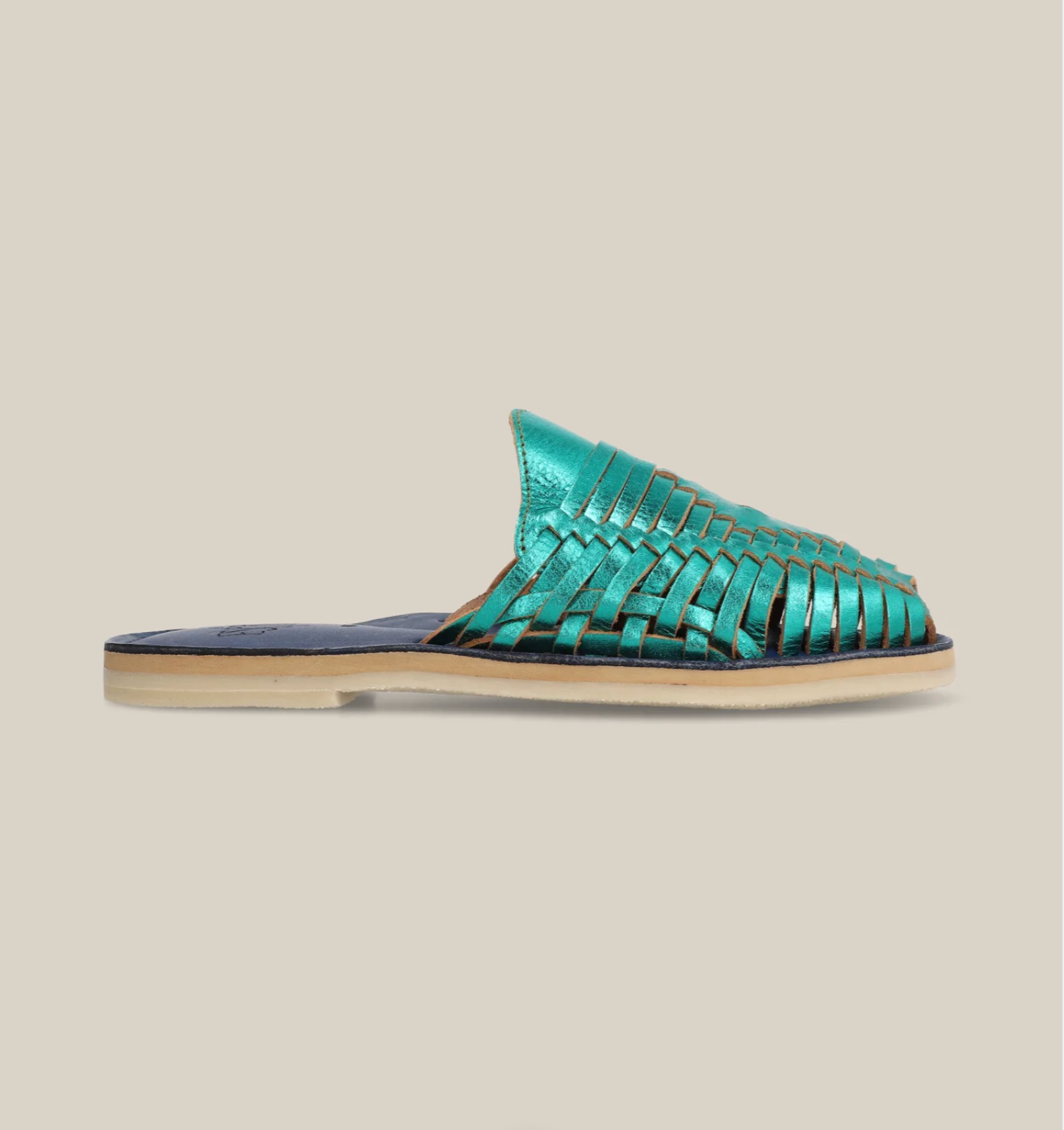 Emerald Slip On Huaraches with woven metallic leather upper and flat beige sole for effortless everyday styling