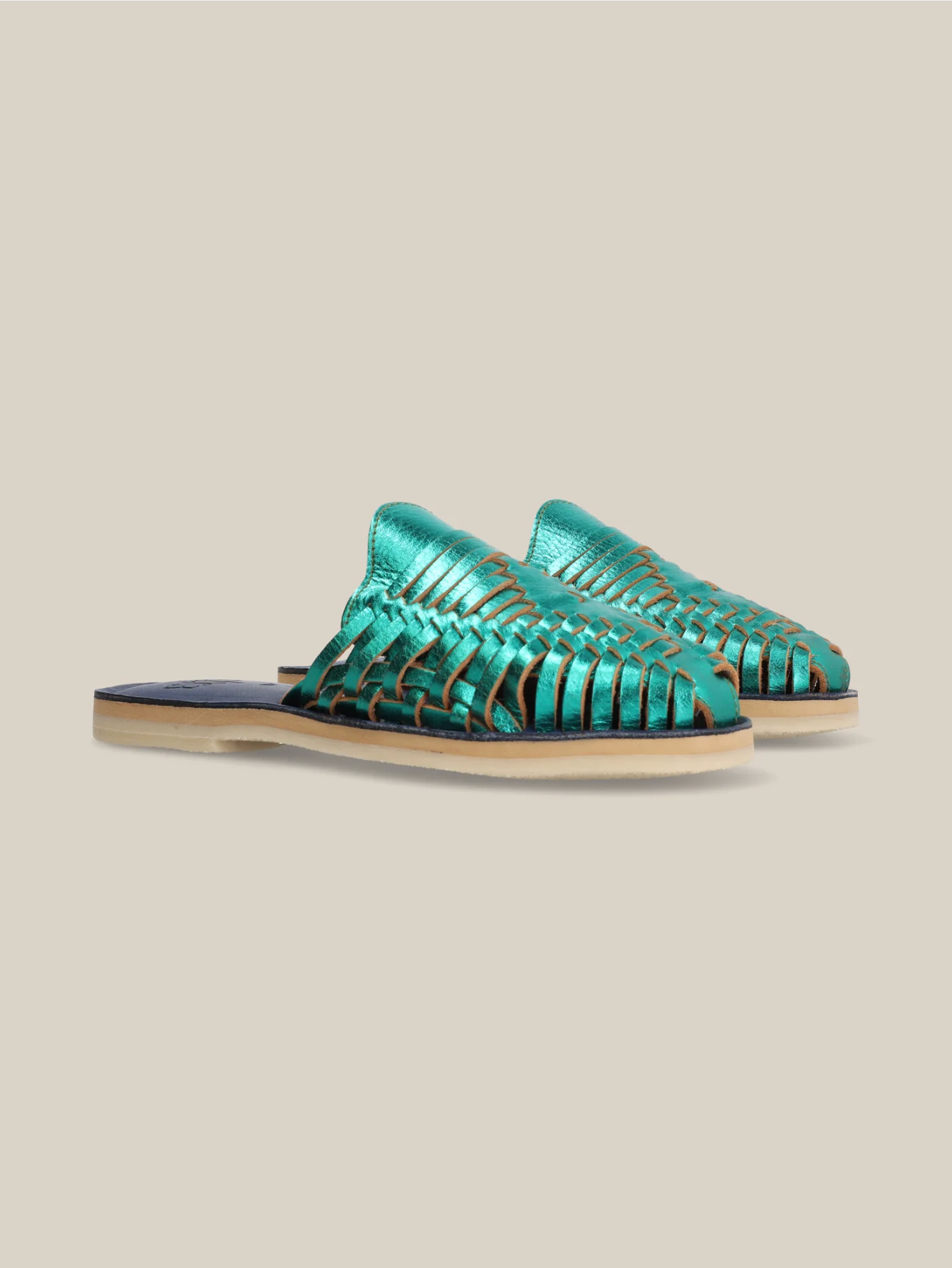 Emerald Slip On Huaraches featuring woven leather upper and neutral sole for a stylish, comfortable look
