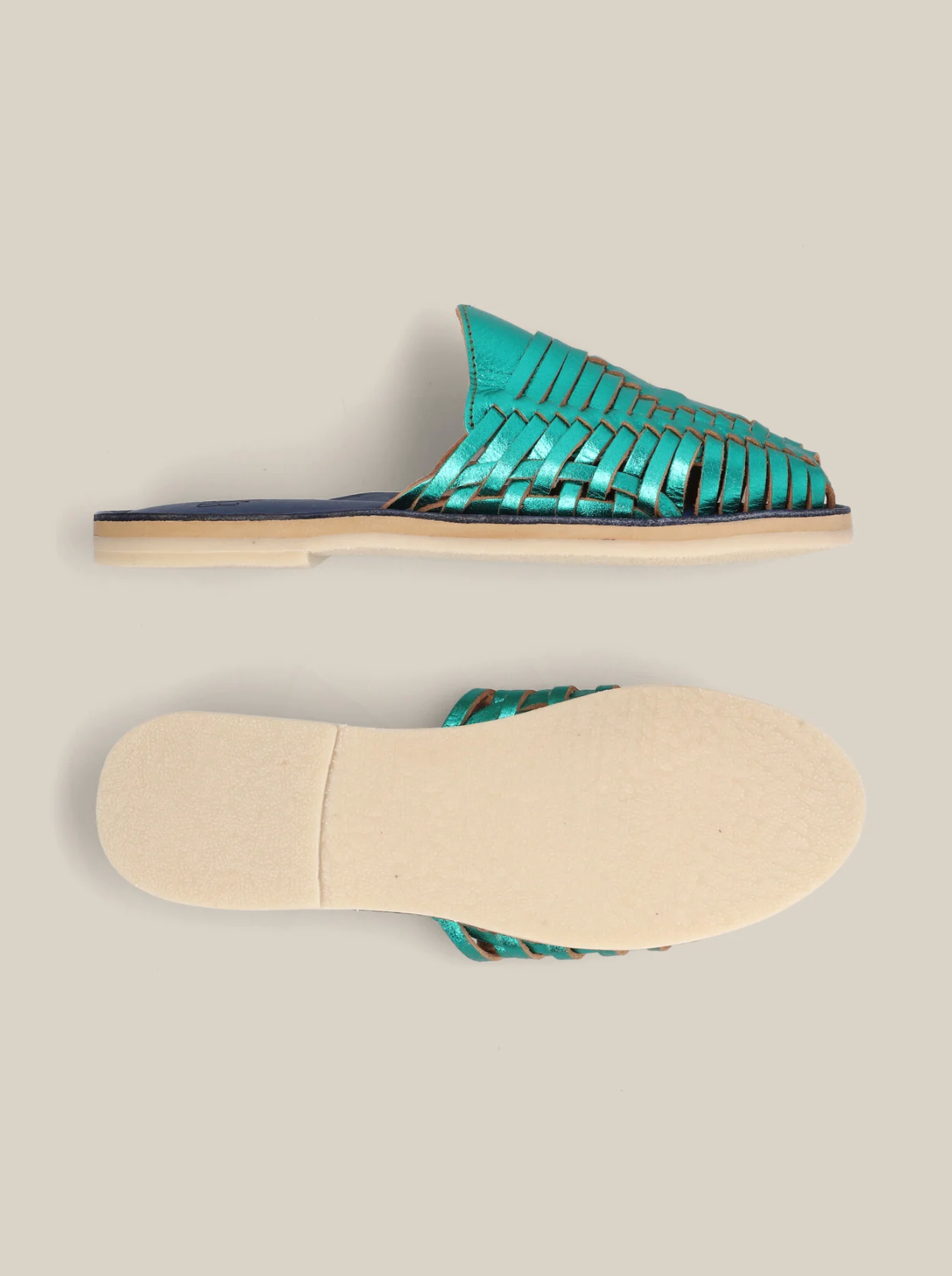 Emerald Slip On Huaraches with woven leather upper and flat beige sole for comfortable everyday wear