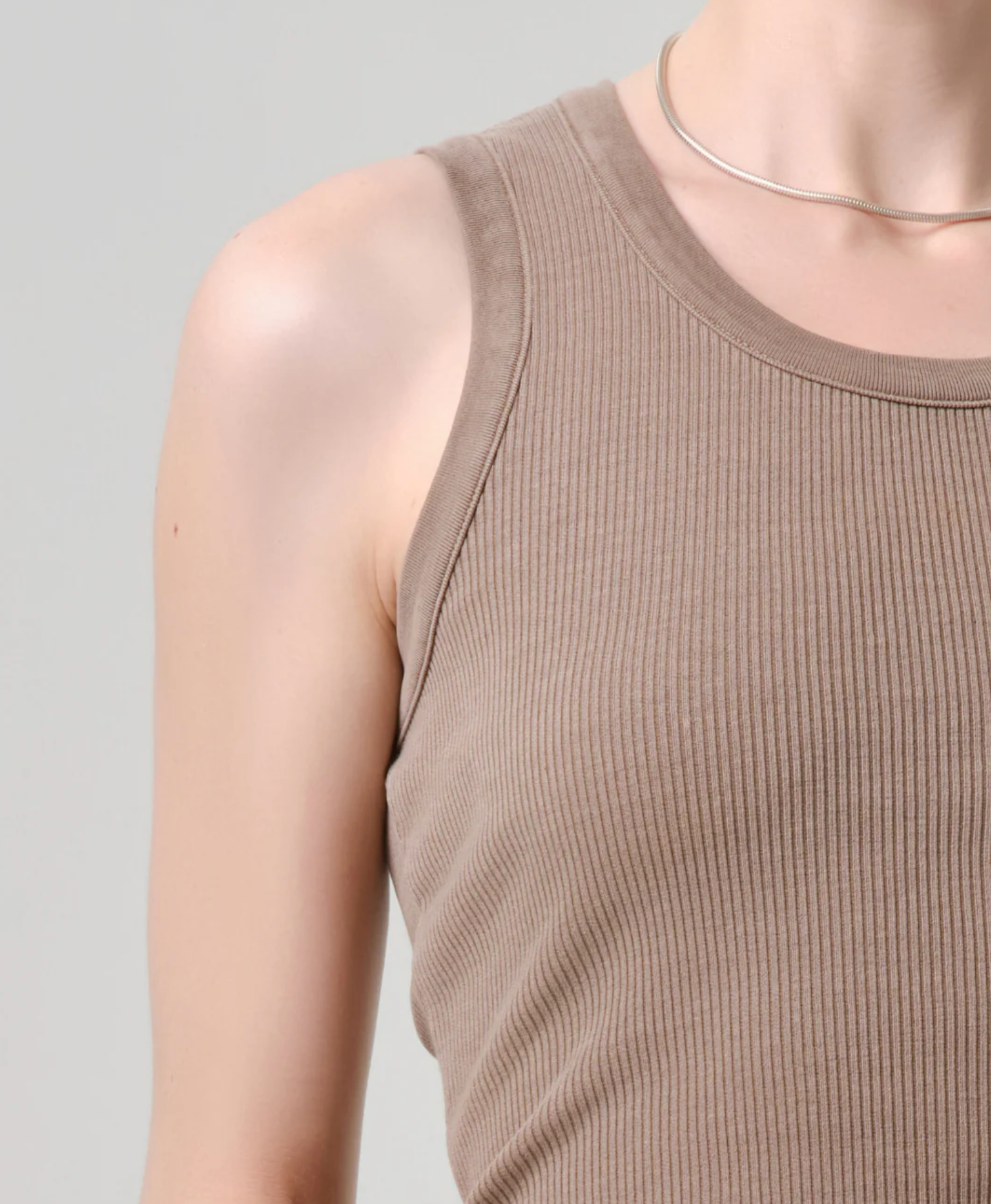 Close-up of a ribbed sleeveless top in warm cocoa tone, The Nova Tank by Citizens of Humanity in Cocoa.