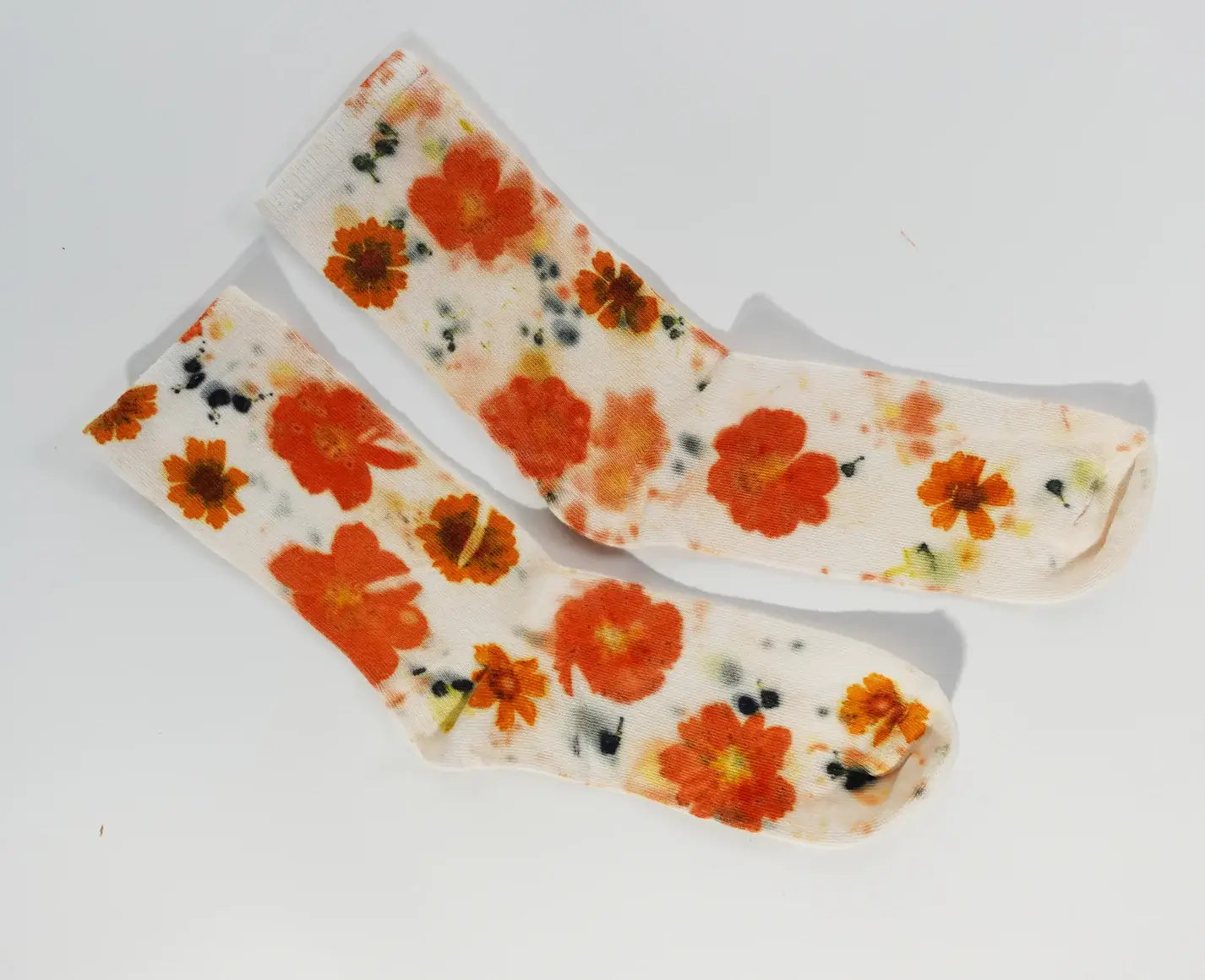Flower Power Cotton Crew Sock with vibrant orange floral print on soft white fabric, perfect for everyday styling.
