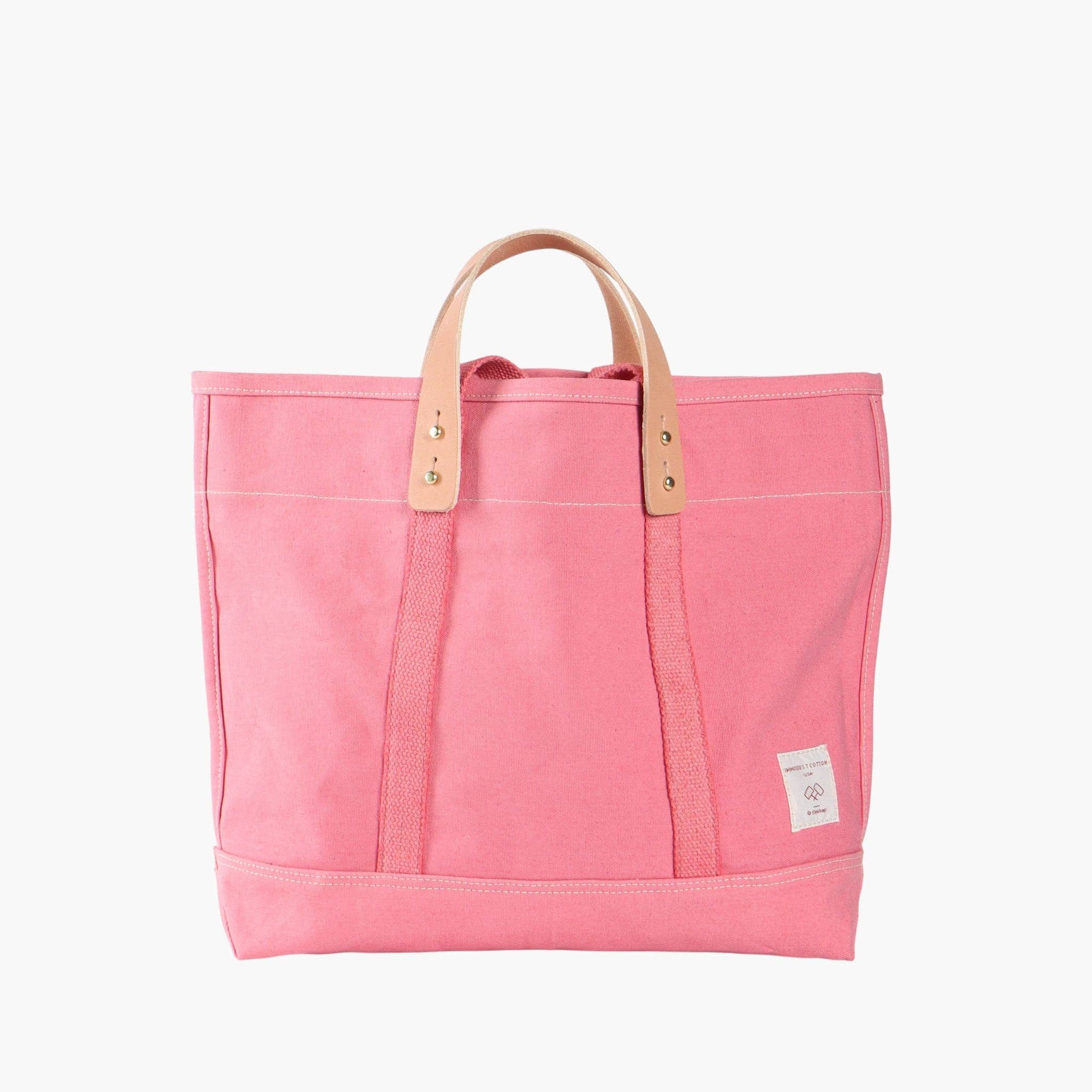 Small East West Tote | Flamingo in vibrant pink canvas with natural leather handles and minimalist design
