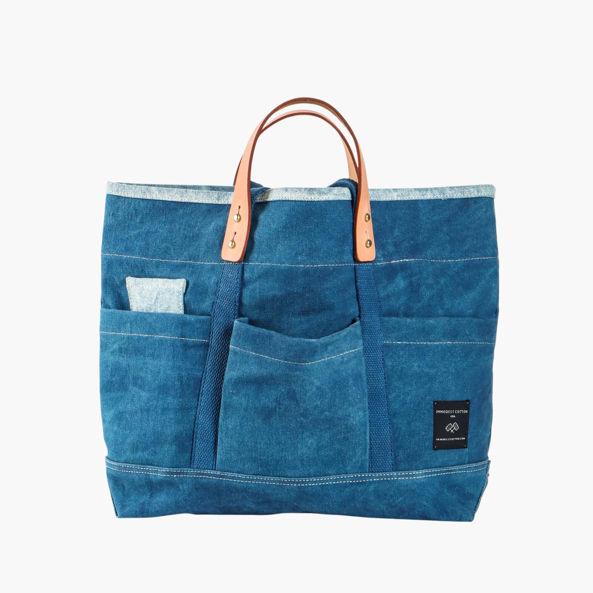 Construction Tote | Denim Sandwich with multiple front pockets and leather handles in blue denim fabric design