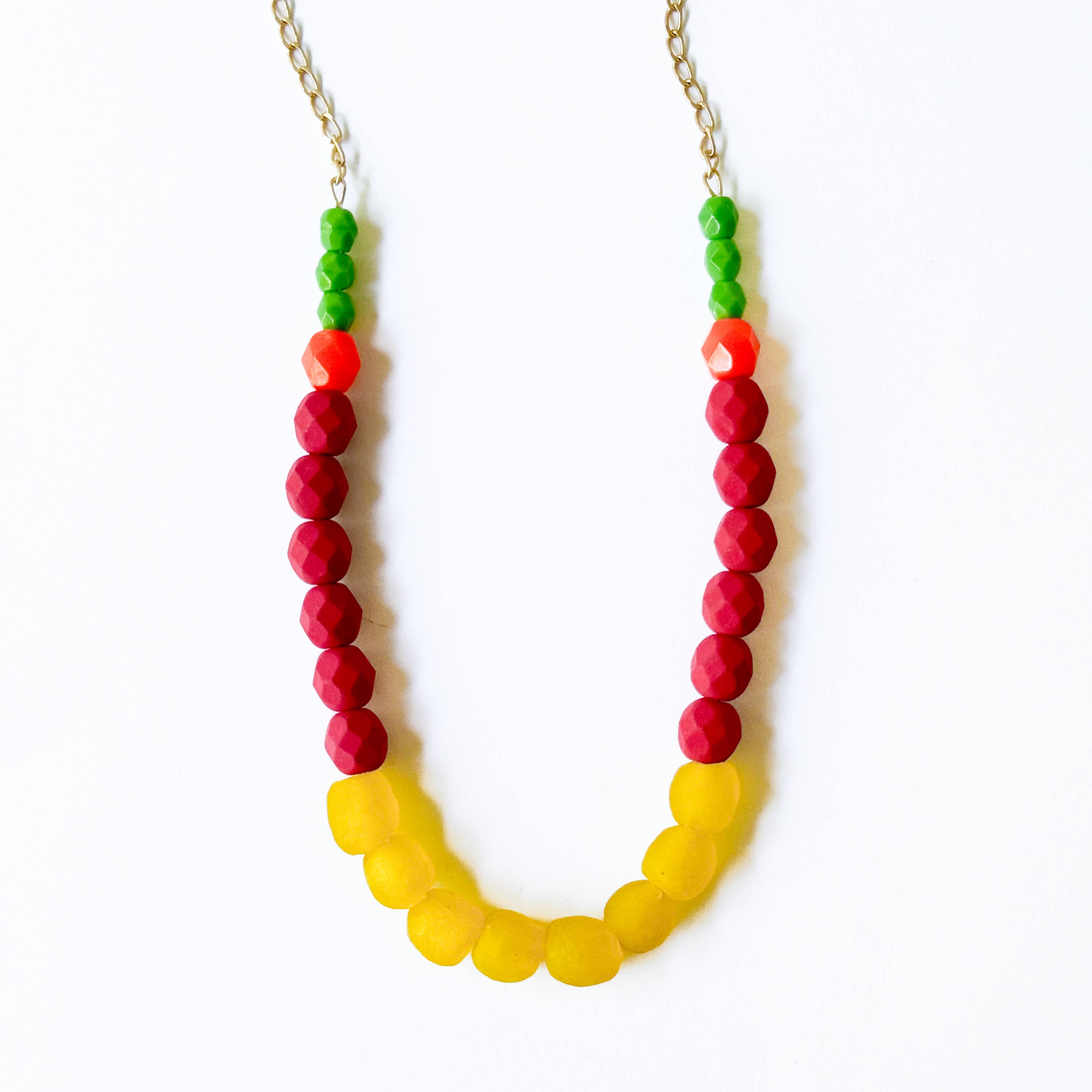 Multicolor Recycled African Glass And Mixed Bead Necklace with yellow, red, orange, and green beads on gold chain