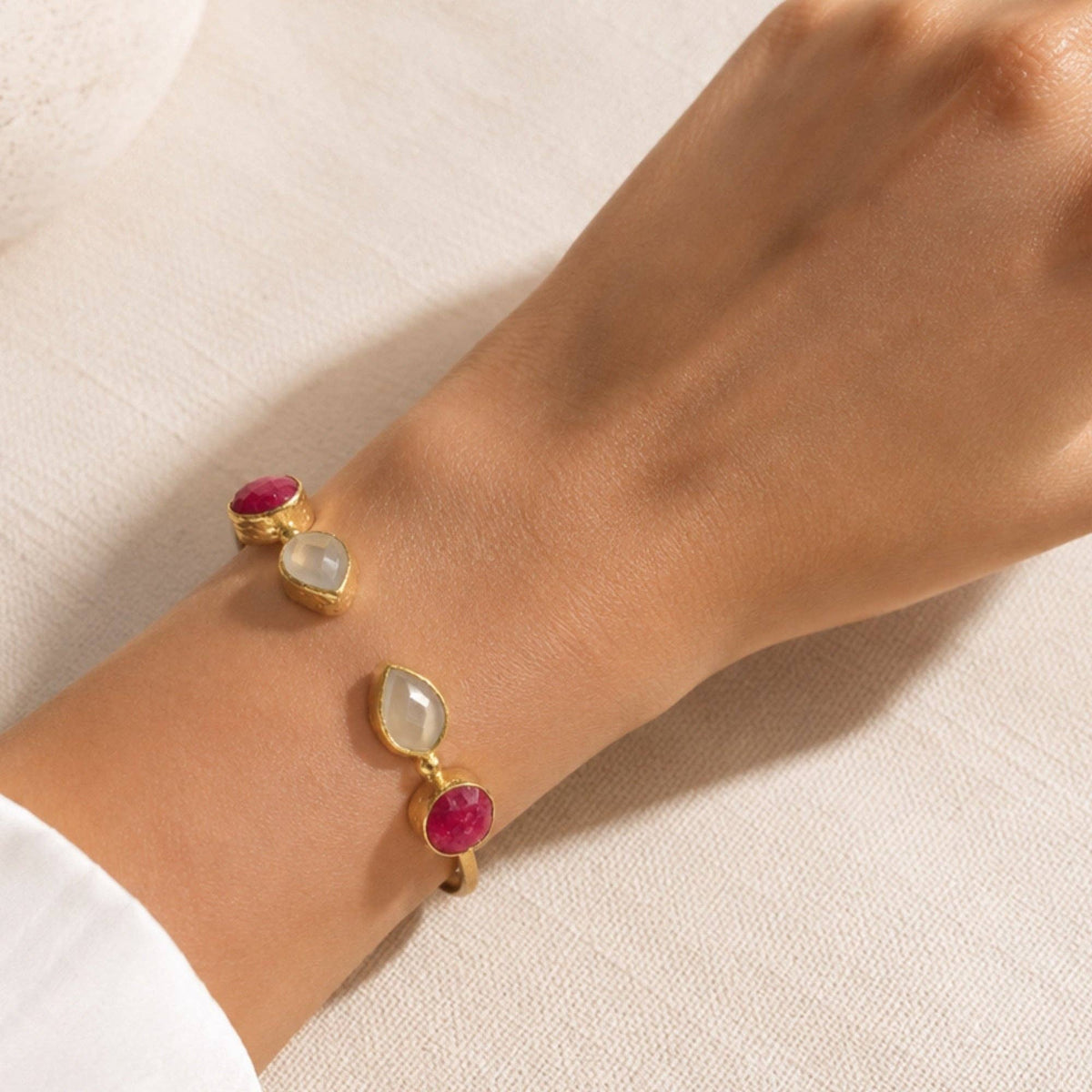 Ruby and Snow Quartz Cuff Bangle | Miray worn on a wrist with ruby and white quartz stones