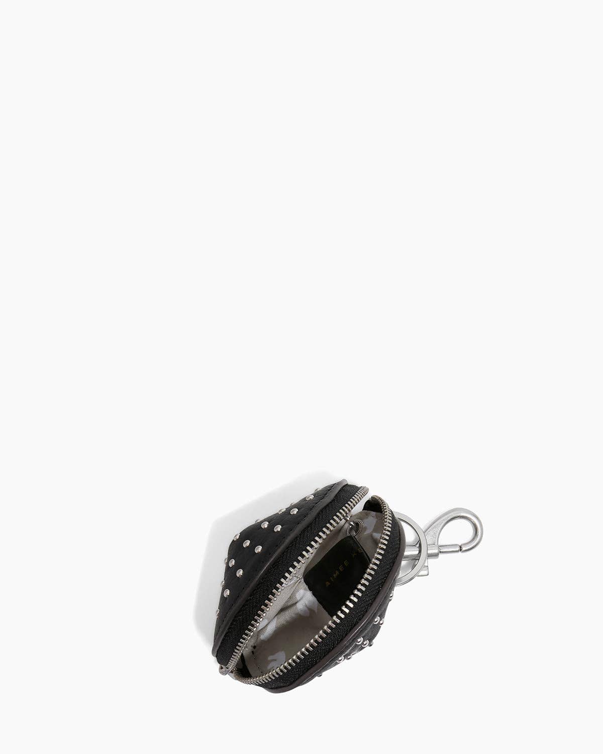 Fortune Zip Charm in black with silver studs and zipper, designed to clip onto bags or keys for stylish accessorizing