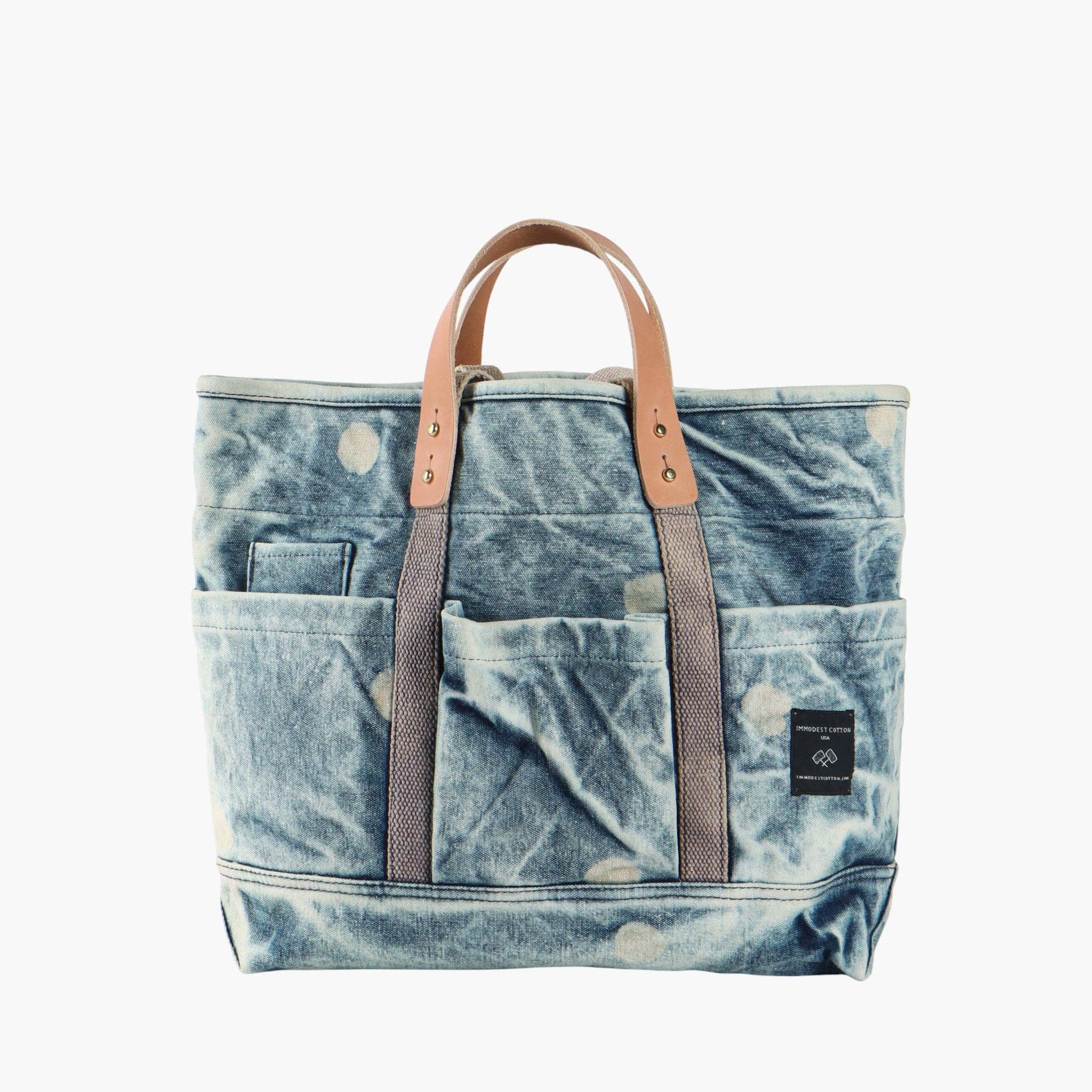 Construction Tote | Denim Moon with multiple exterior pockets and leather handles in a washed denim fabric design