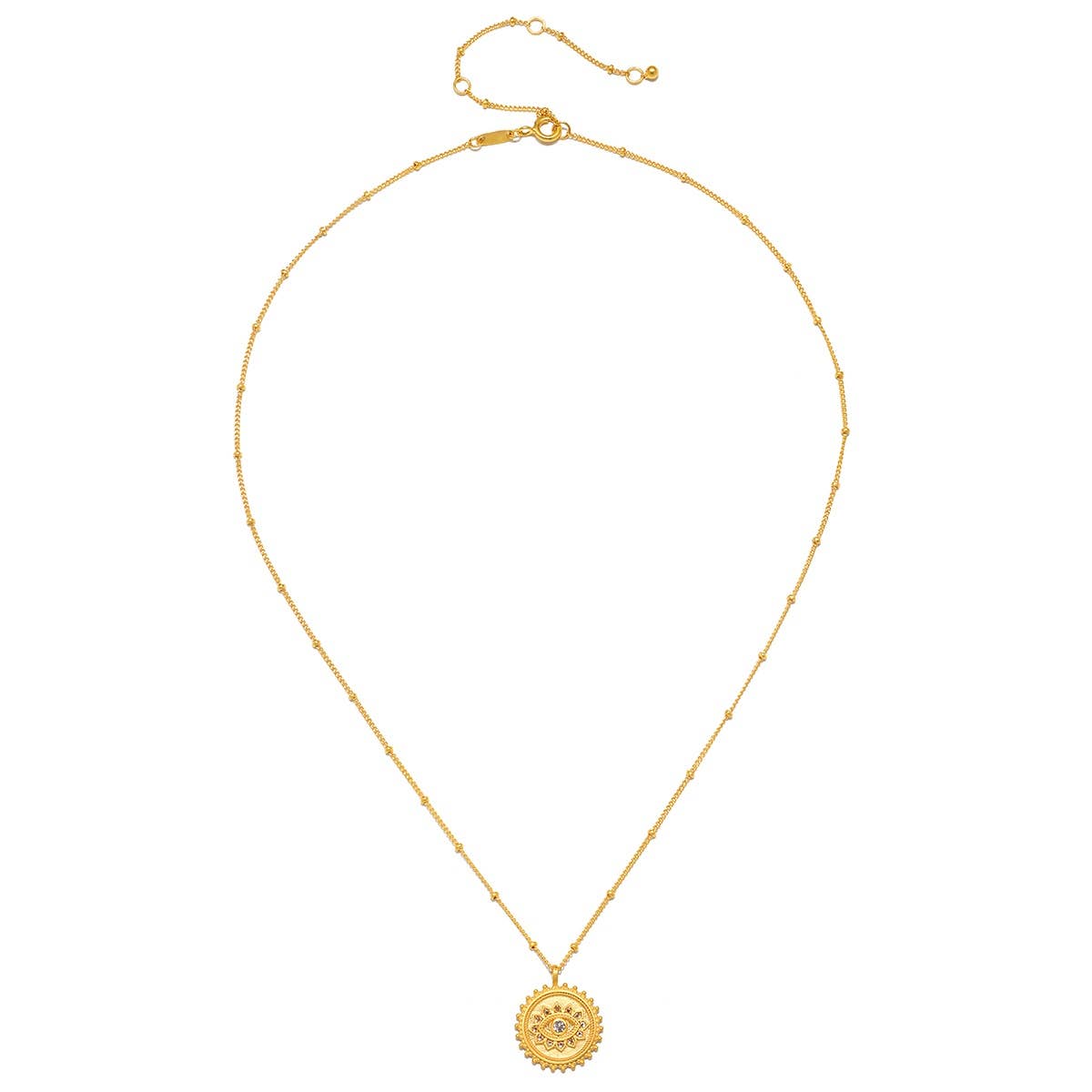 The Satya Jewelry True Visionary White Topaz Evil Eye Necklace 18" features a delicate 18k gold plate chain, accented with small beads and a round, ornate evil eye pendant at the center, plus an adjustable clasp for the perfect fit.