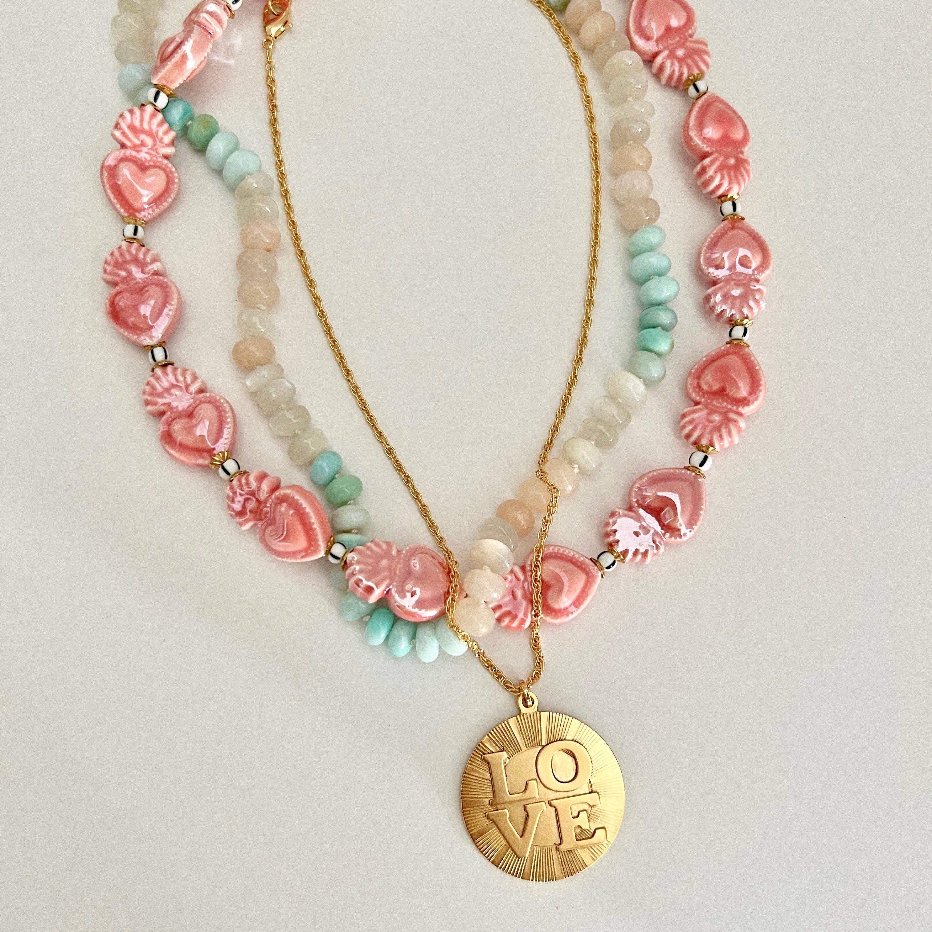 LOVE pendant gold necklace with heart beads in pink, white, and turquoise colors, feminine and elegant style