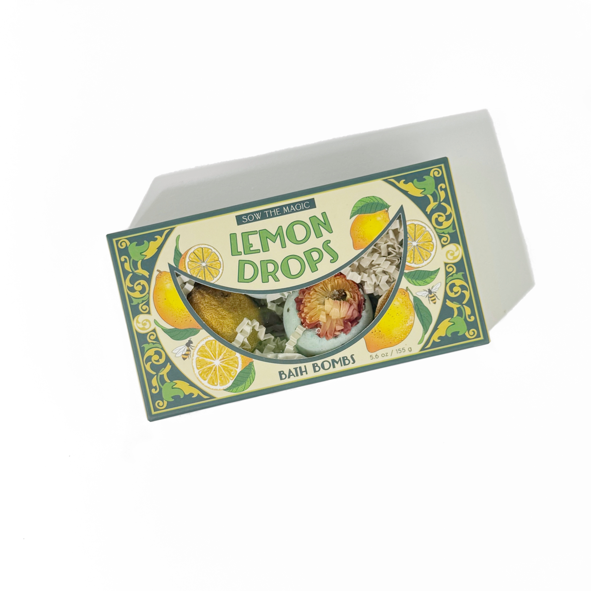 Natural Lemon Drop Bath Bomb Gift Set made with Lemon + MInt featuring citrus design and visible bath bombs inside packaging box
