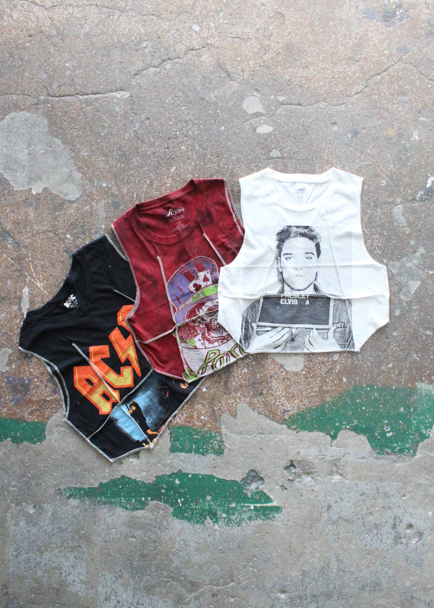 Three vintage style graphic muscle tees including the Overlock Cropped Music Muscle Tee in white with Elvis print