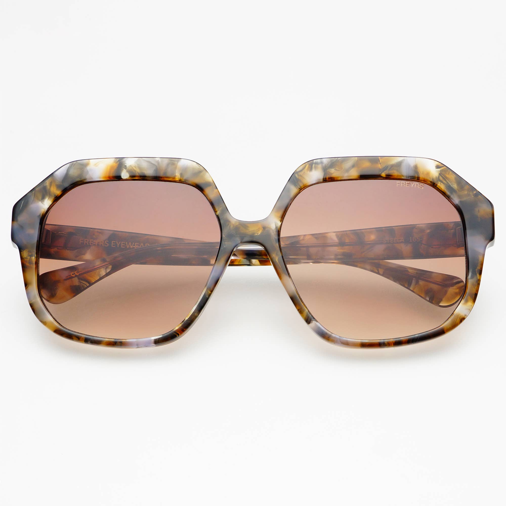 FREYRS Eyewear Stella Acetate Womens Octagonal Sunglasses feature oversized, handmade marbled brown, gray, and cream frames with gradient brown lenses offering UVA/UVB protection. Shown on a white background, facing forward.