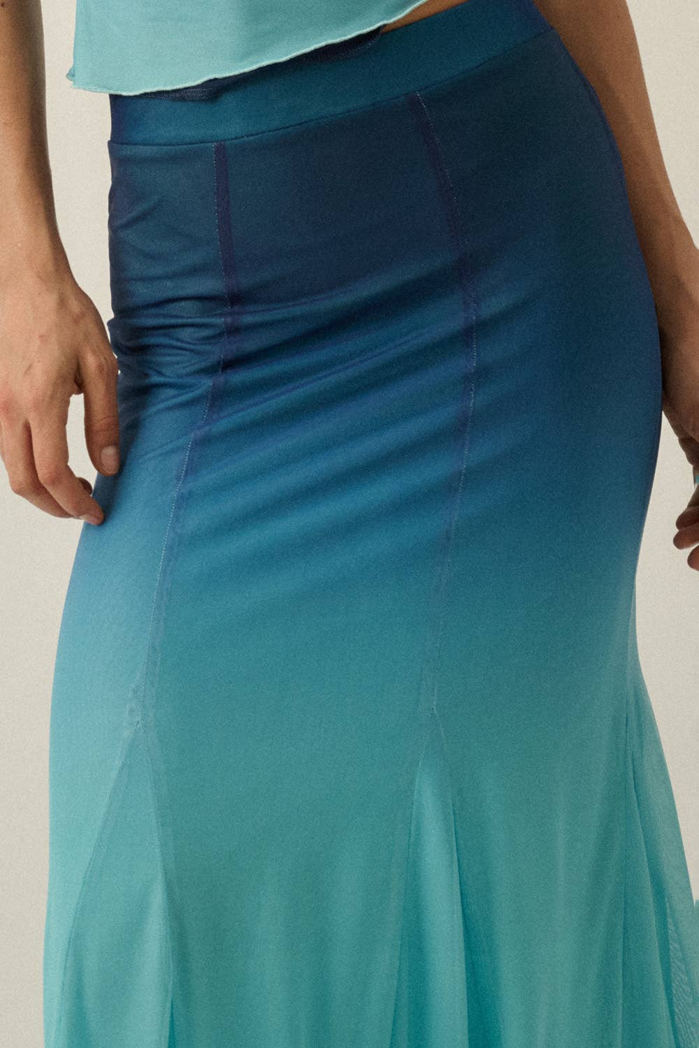 Close-up of blue Ombre Mesh Fit-and-Flare Godet Maxi Skirt with smooth gradient and mesh fabric detailing.