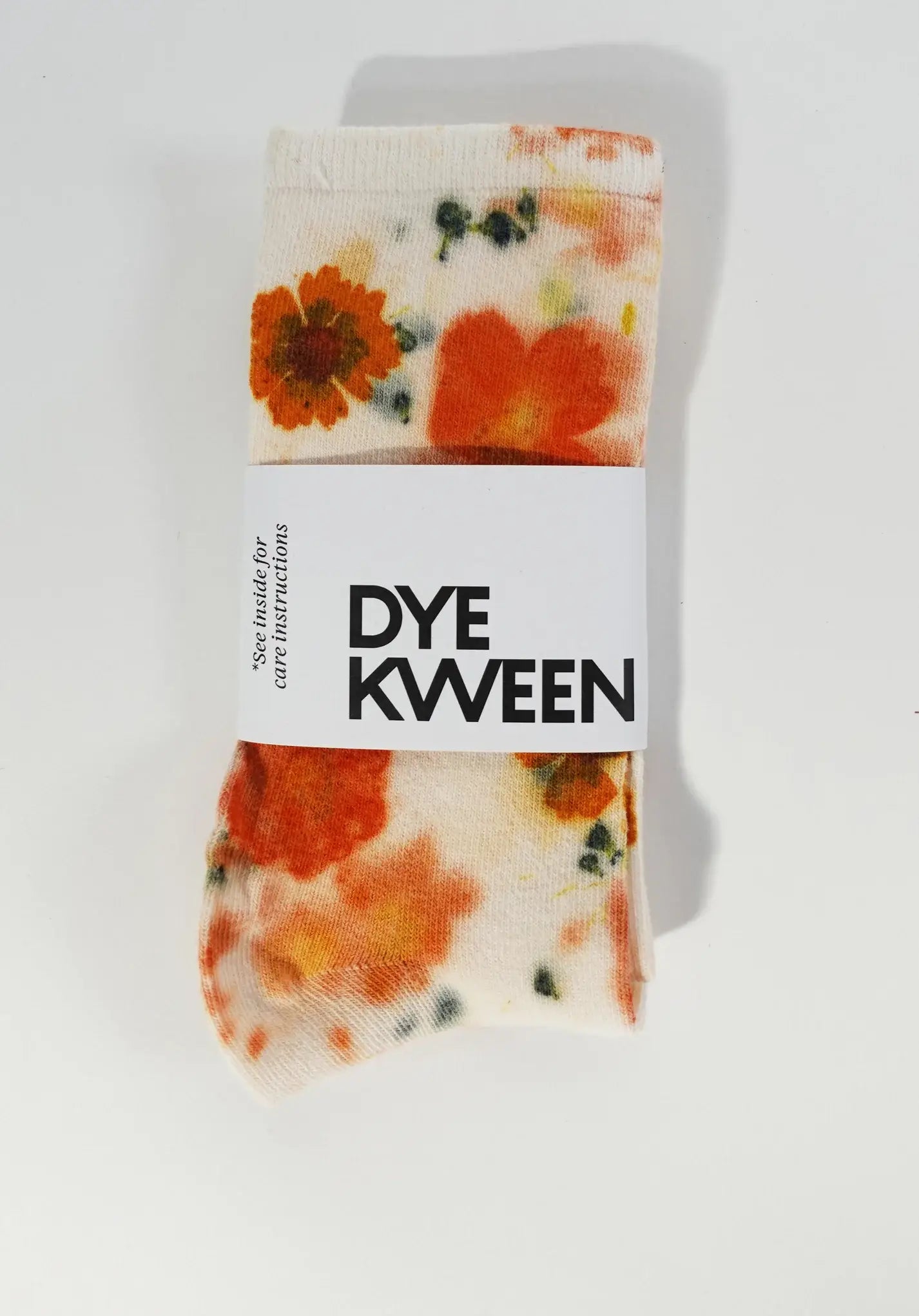 Folded Flower Power Cotton Crew Sock with vibrant orange floral pattern on cream background and Dye Kween label