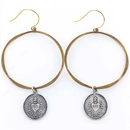 A pair of Tara Gasparian Jewelry San Miguel Hoop - Multi earrings featuring gold hoops and silver medallion pendants embossed with a crown and laurel wreath design.