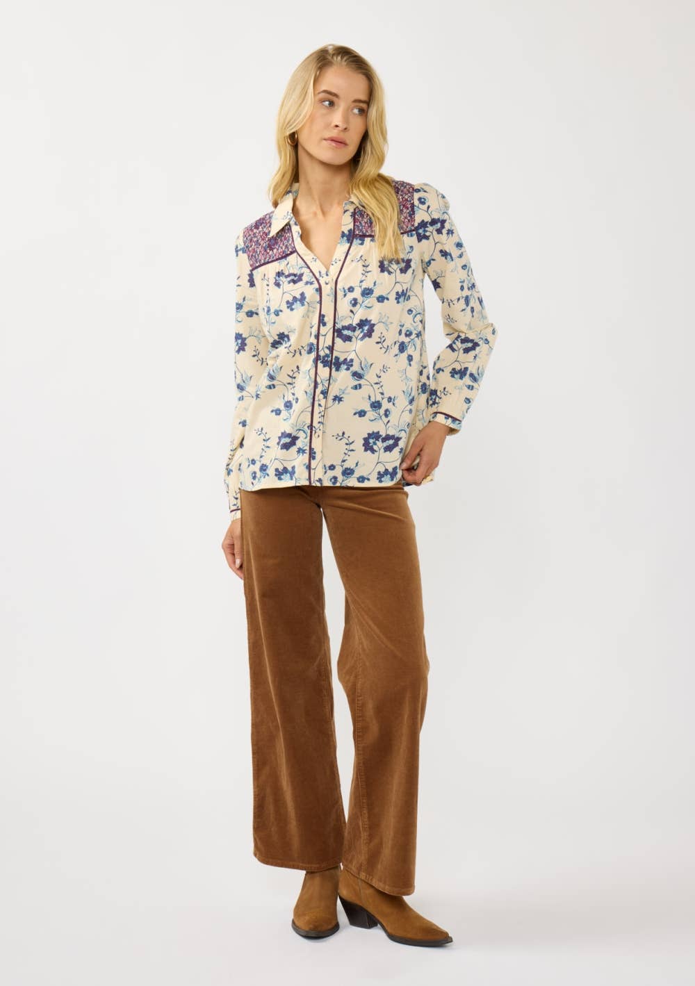 Woman wearing Long Sleeve Floral Blouse with Smocked Yoke paired with brown wide-leg pants and ankle boots.
