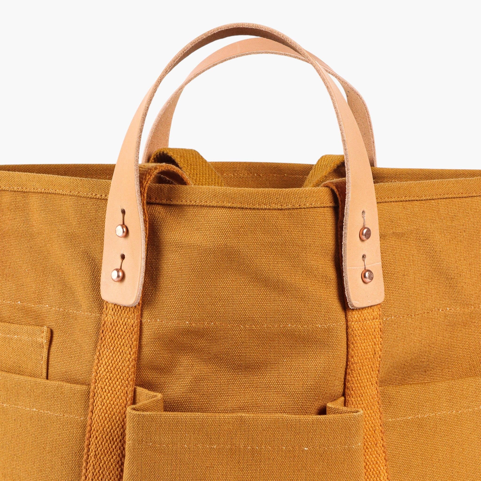Construction Tote | Mustard Seed with durable canvas, natural leather handles, and multiple exterior pockets for easy organization