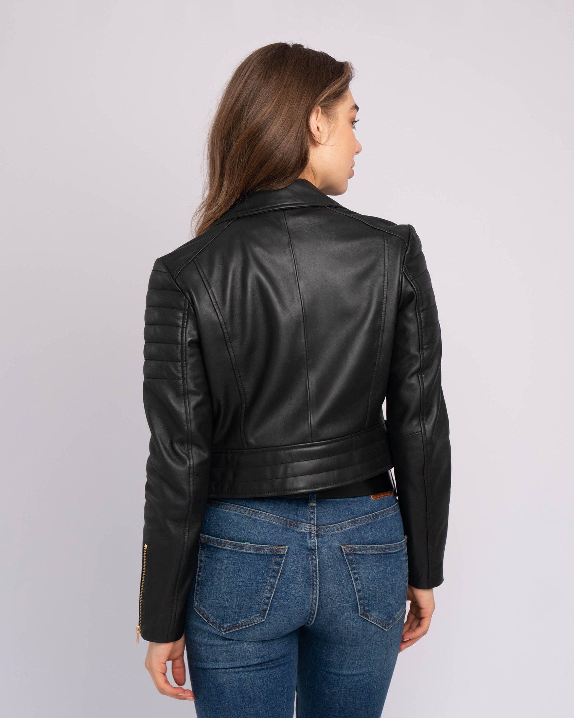 Woman wearing a black Eureka | Leather Biker Jacket showing detailed back stitching and padded sleeves.
