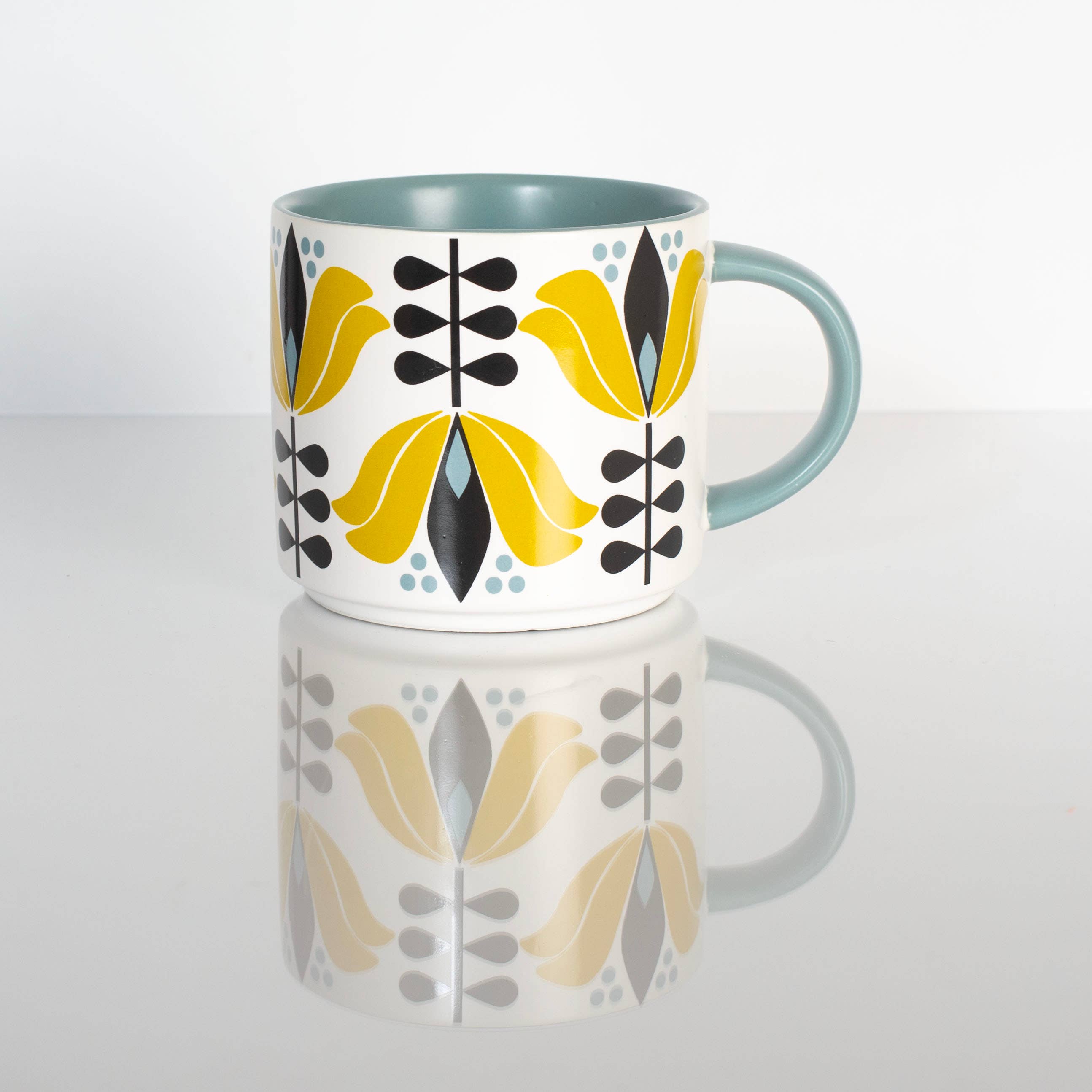 Yellow Lotus Flower Mid Century Stackable Matte Coffee Mug with teal handle and geometric floral design on white background