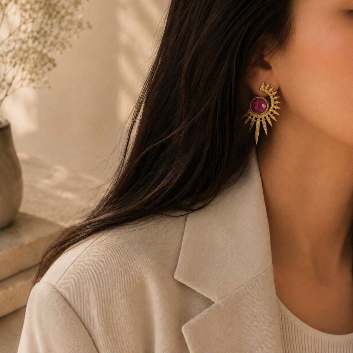 Sabira Ruby Crescent Sunburst Earrings with a ruby center and radiant gold sunburst design
