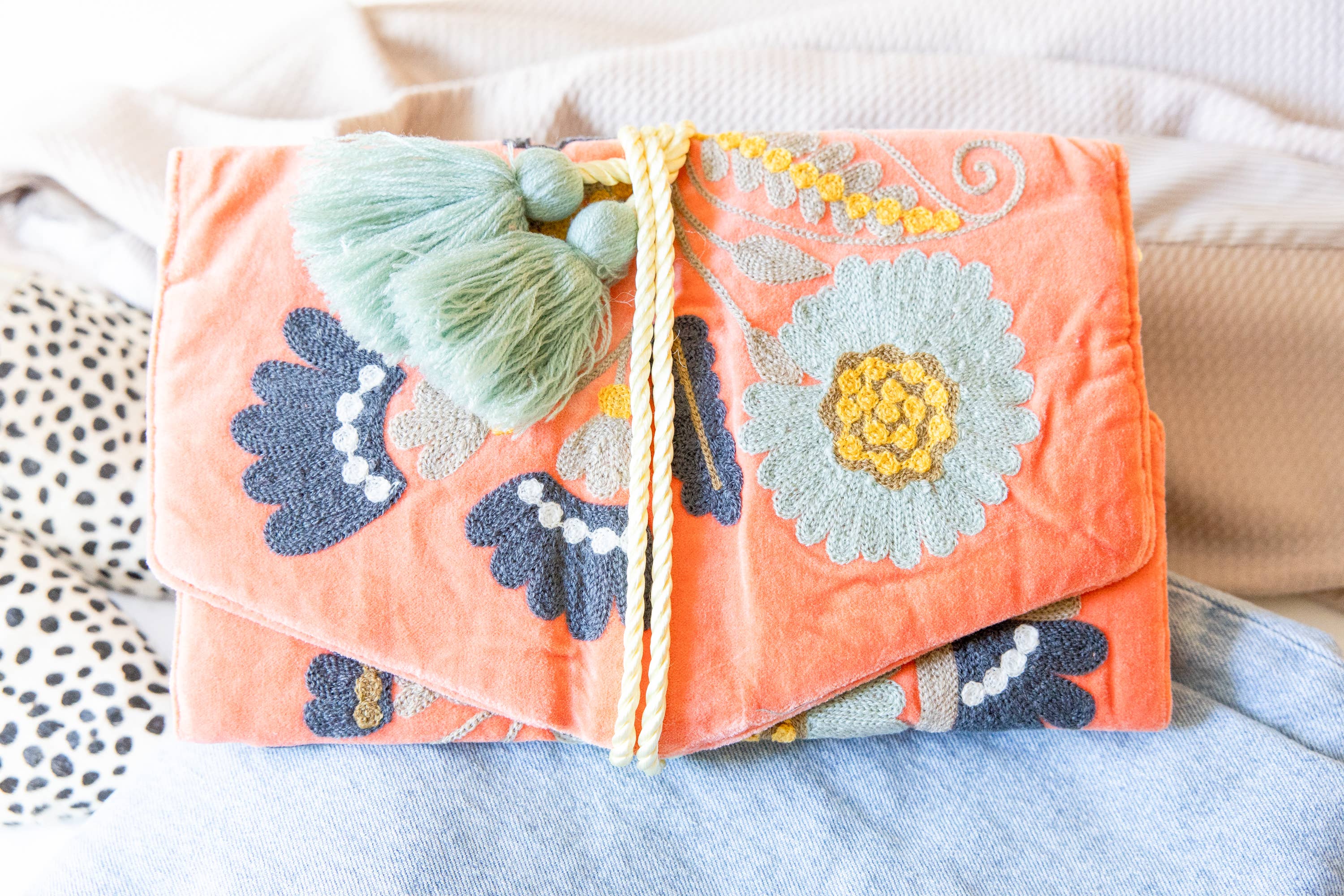 Embroidered Velvet Jewelry Organizer-Coral with colorful floral embroidery and soft tassel detail on coral velvet fabric