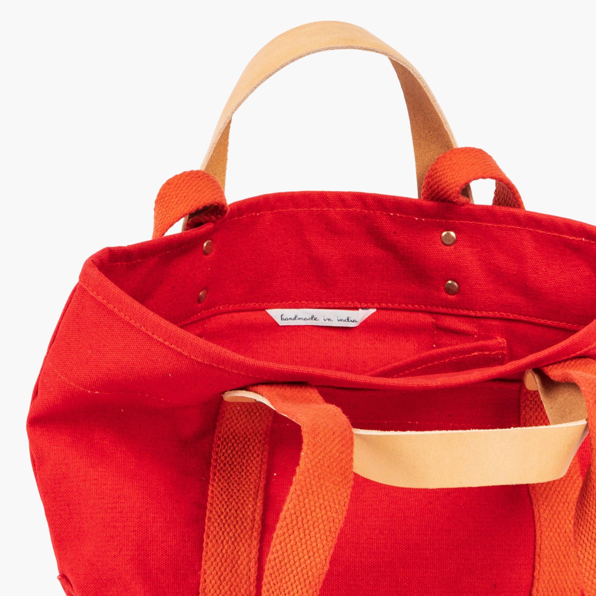 Lunch Tote | Persimmon canvas bag with leather handle and orange straps, featuring handmade artisan details inside