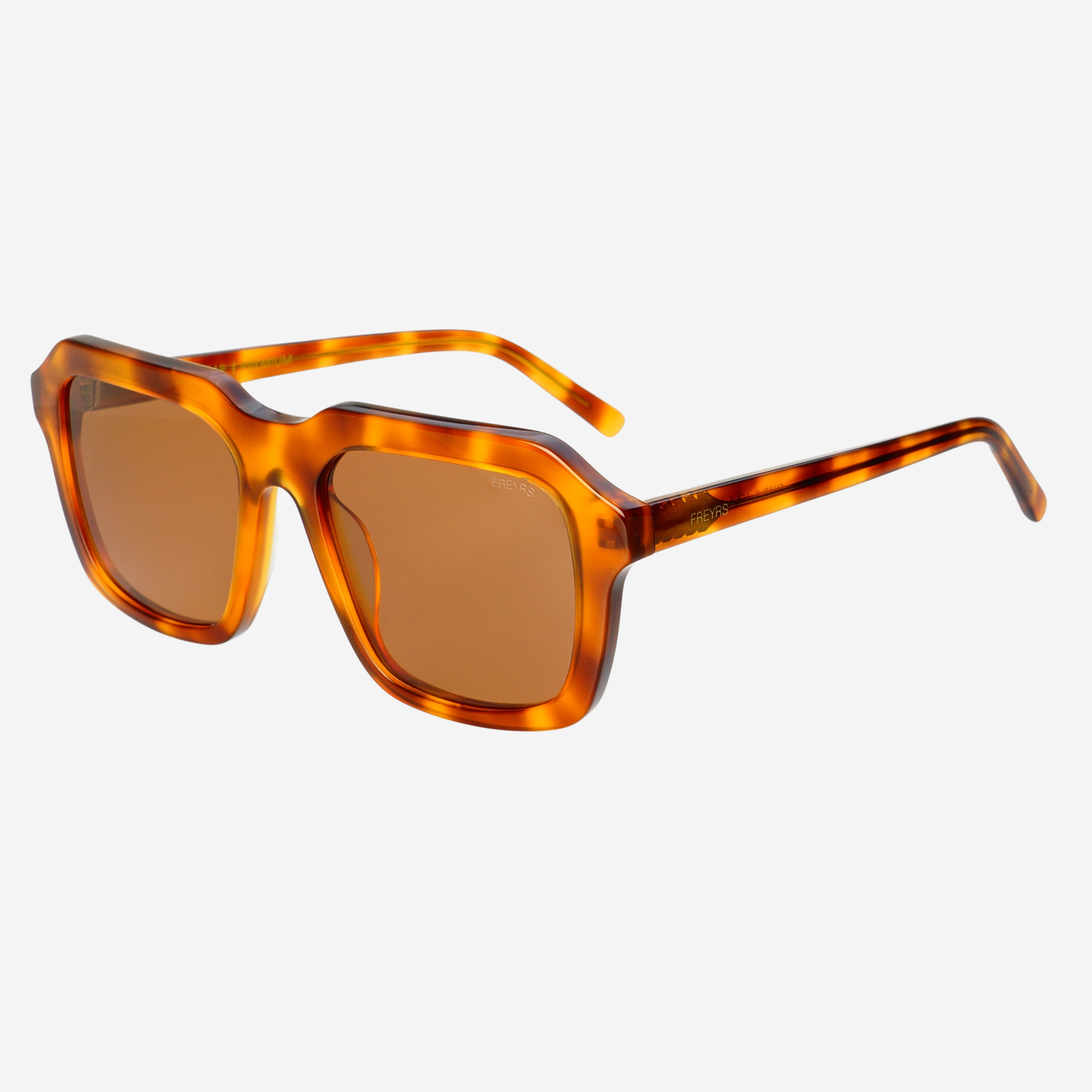 FREYRS Eyewear’s Charlie Acetate Unisex Rectangular Sunglasses feature thick, glossy amber-brown handmade frames and brown nylon lenses with UVA/UVB protection, displayed on a white background.