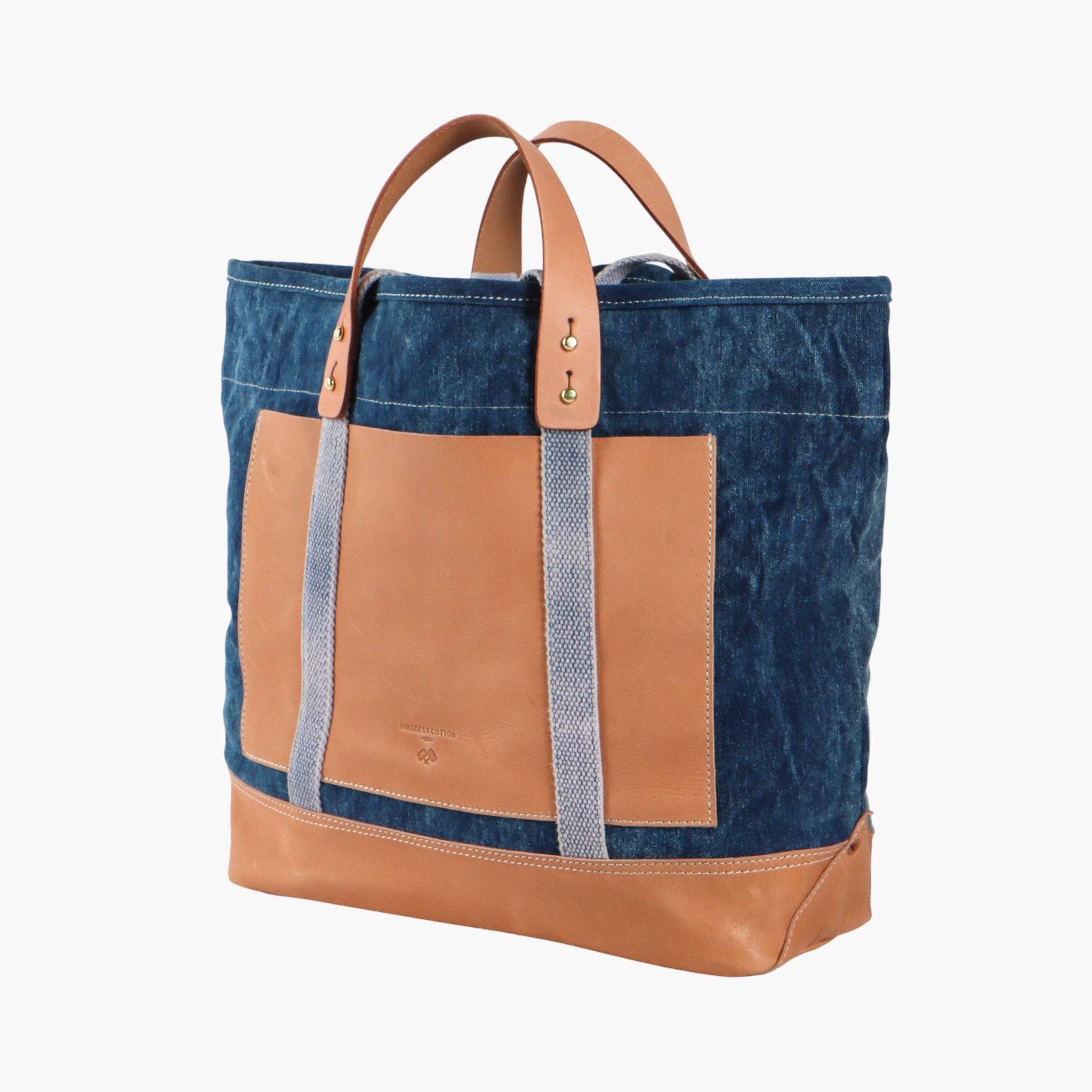 Editor Tote | Indigo + Tan featuring durable indigo canvas with tan leather accents and sturdy leather handles for everyday style
