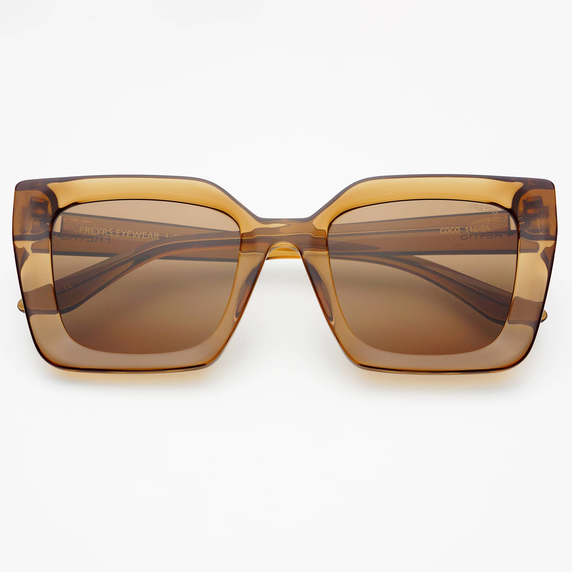 Coco Acetate Womens Square Sunglasses by FREYRS Eyewear feature oversized, translucent brown acetate frames and brown tinted lenses for UV protection. Displayed on a plain white background.